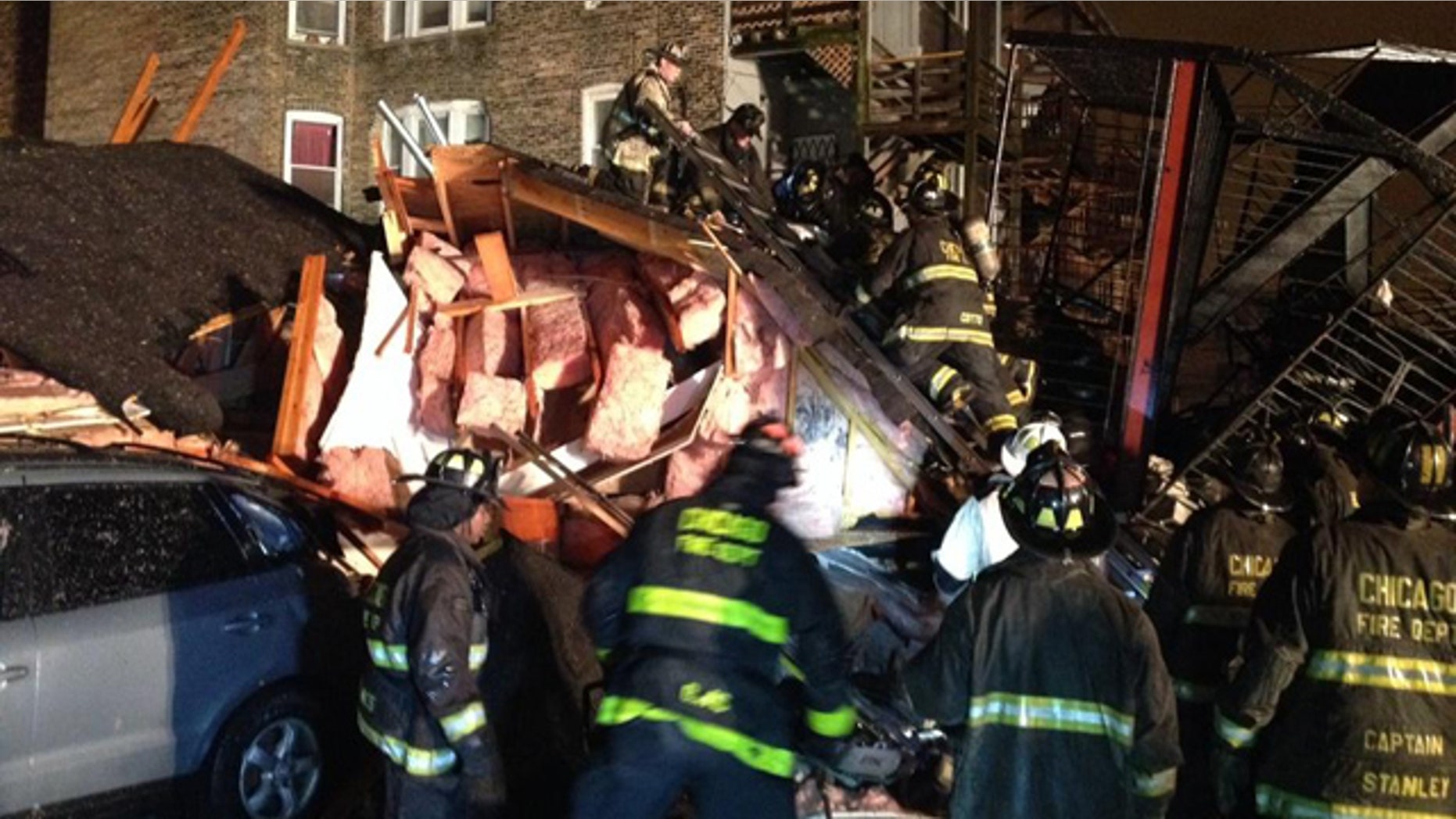 November 23, 2014: Chicago firefighters sift through the rubble of an apartment building that collapsed after a possible gas explosion on the city's South Side Sunday evening. (MyFoxChicago.com)