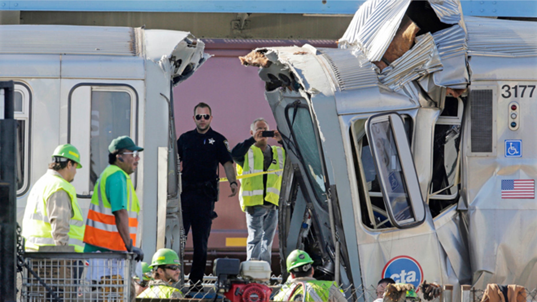 Sept. 30, 2013: Authorities inspect the wreckage of two Chicago Transit Authority trains that crashed in Forest Park, Ill.