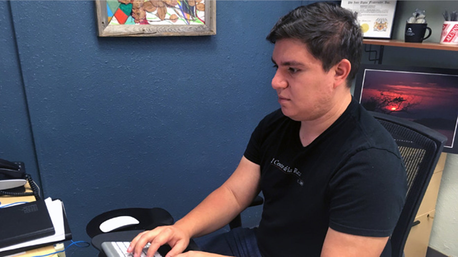 Alejandro Mendiaz-Rivera, 26, a University of New Mexico graduate student and an immigrant who had been granted temporary protection from deportation, works in an office on campus on Thursday, June 23, 2016. The Supreme Court deadlocked Thursday on President Barack Obama's immigration plan that sought to shield millions living in the U.S. illegally from deportation, effectively killing the plan for the rest of his presidency. (AP Photo/Russell Contreras)