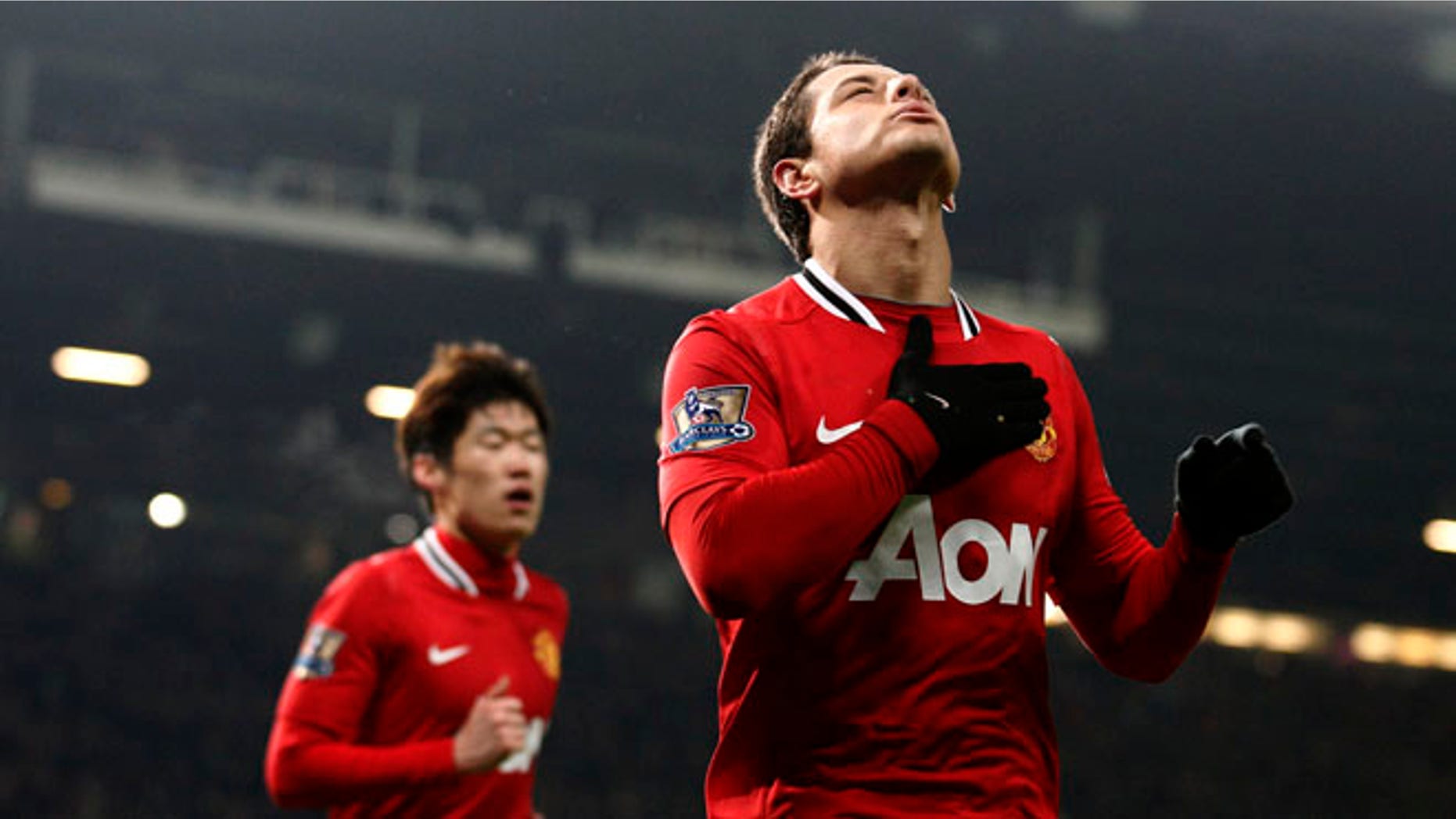 Manchester United's Javier Hernandez celebrates after scoring against Stoke, Jan. 31, 2012. (AP Photo/Jon Super)