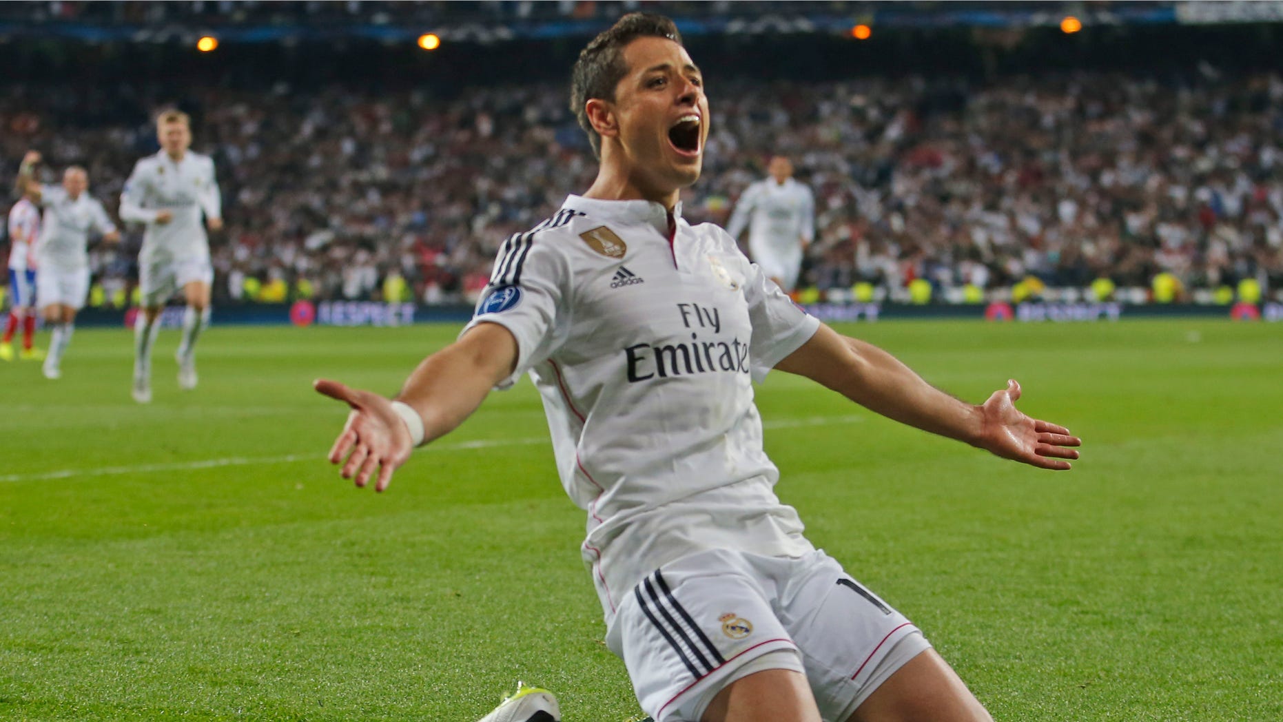 Real Madrid's Chicharito celebrates scoring his side's first goal during the second leg quarterfinal Champions League soccer match between Real Madrid and Atletico Madrid at Santiago Bernabeu stadium in Madrid, Spain, Wednesday April 22, 2015. Real won the match with a 1-0 score and advances to the semifinal. (AP Photo/Paul White)