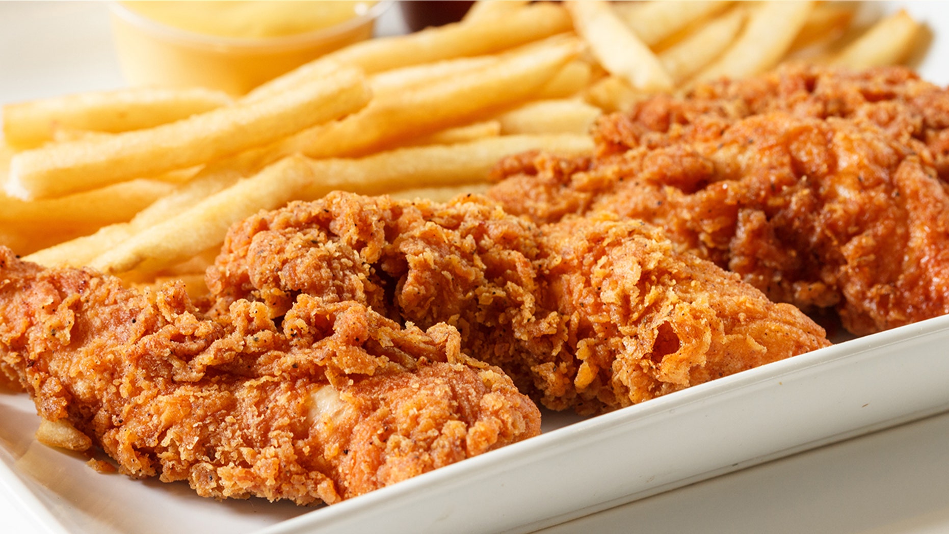 A woman was caught on camera dipping her chicken finger in soda.