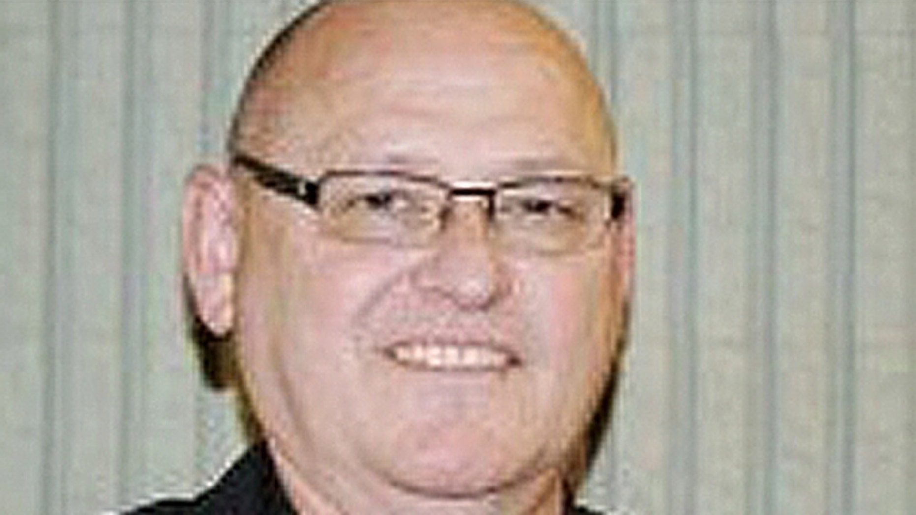 FILE - In this undated file photo released by the Peachtree City Police Department, Chief William McCollom poses for a photograph. McCollom, who said he accidentally shot his ex-wife while they slept was indicted Wednesday on a misdemeanor reckless-conduct charge, a prosecutor said. (Peachtree City Police Department via AP, File)