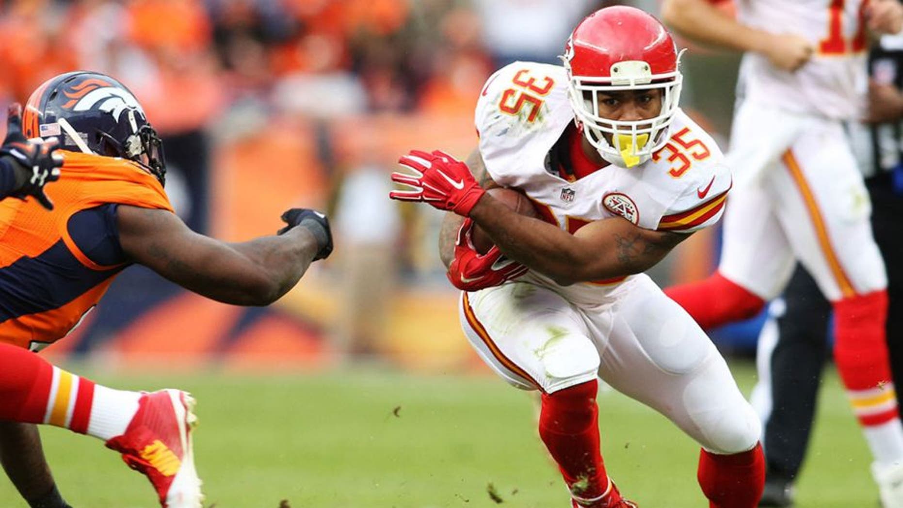 Nov 15, 2015; Denver, CO, USA; Kansas City Chiefs running back Charcandrick West (35) runs the ball during the first half against the Denver Broncos at Sports Authority Field at Mile High. Mandatory Credit: Chris Humphreys-USA TODAY Sports
