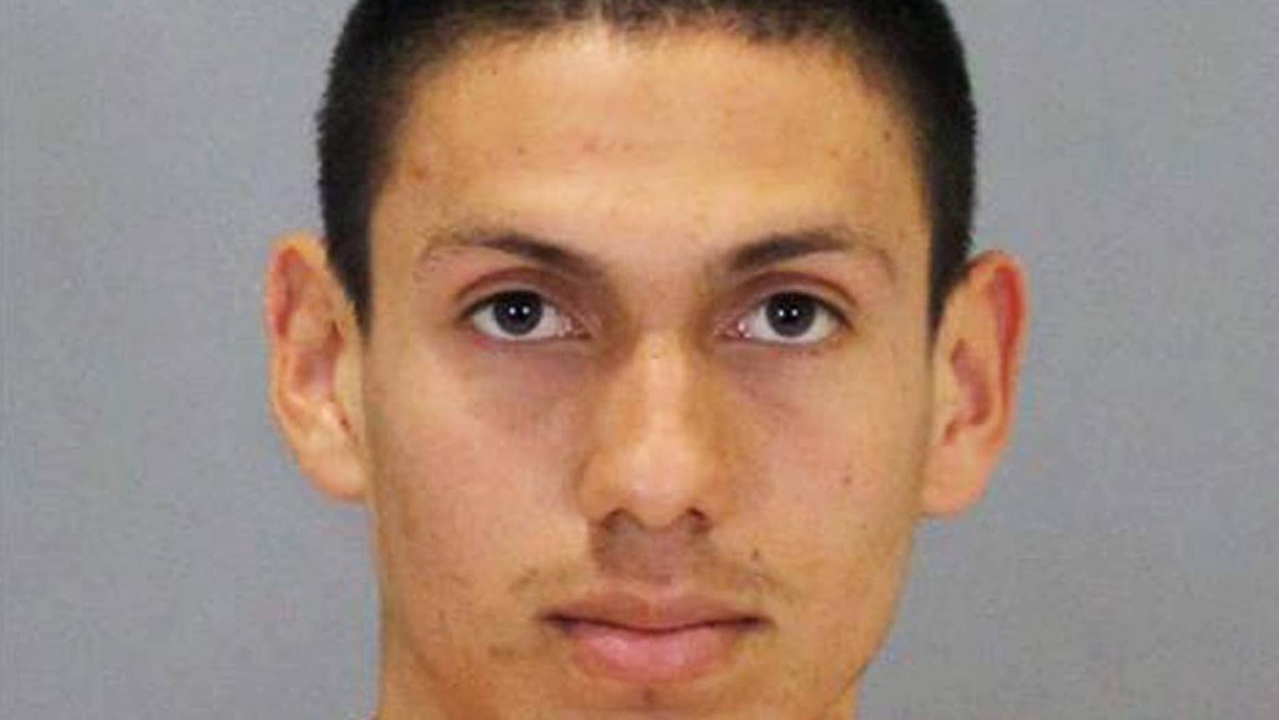 This undated photo provided by the Omaha Police Department shows Roberto Martinez-Marinero, who was arrested Thursday, May 7, 2015, after walking into the Douglas County Department of Corrections, in Nebraska, and telling jail staff that he was involved in the death of his mother, police said. The body of 45-year-old Jesus Ismenia Marinero was found in a ditch a day earlier. (Omaha Police Department via AP)