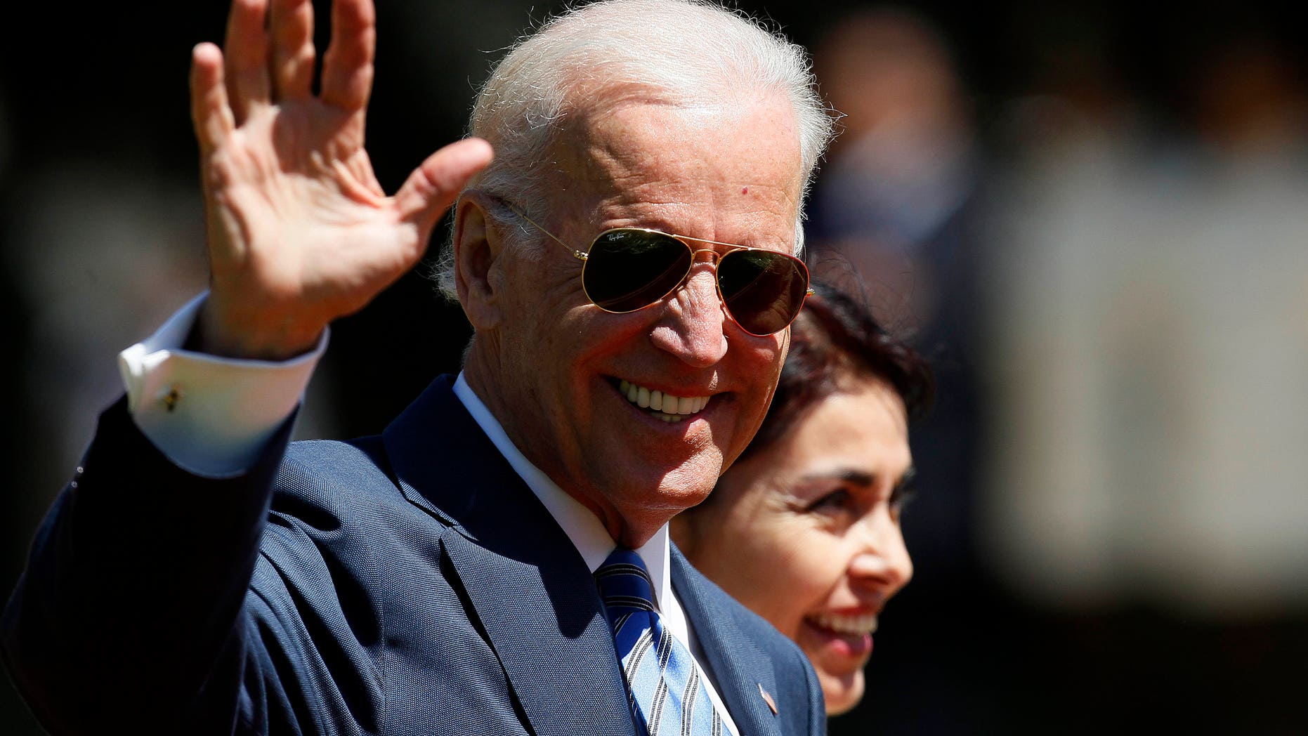 Vice President Joe Biden waves as he walks through the Cerro Castillo palace gardens on his way to having lunch with Chile's newly sworn-in President Michelle Bachelet, in Vina del Mar, Chile, Tuesday, March 11, 2014. (AP Photo/Luis Hidalgo)