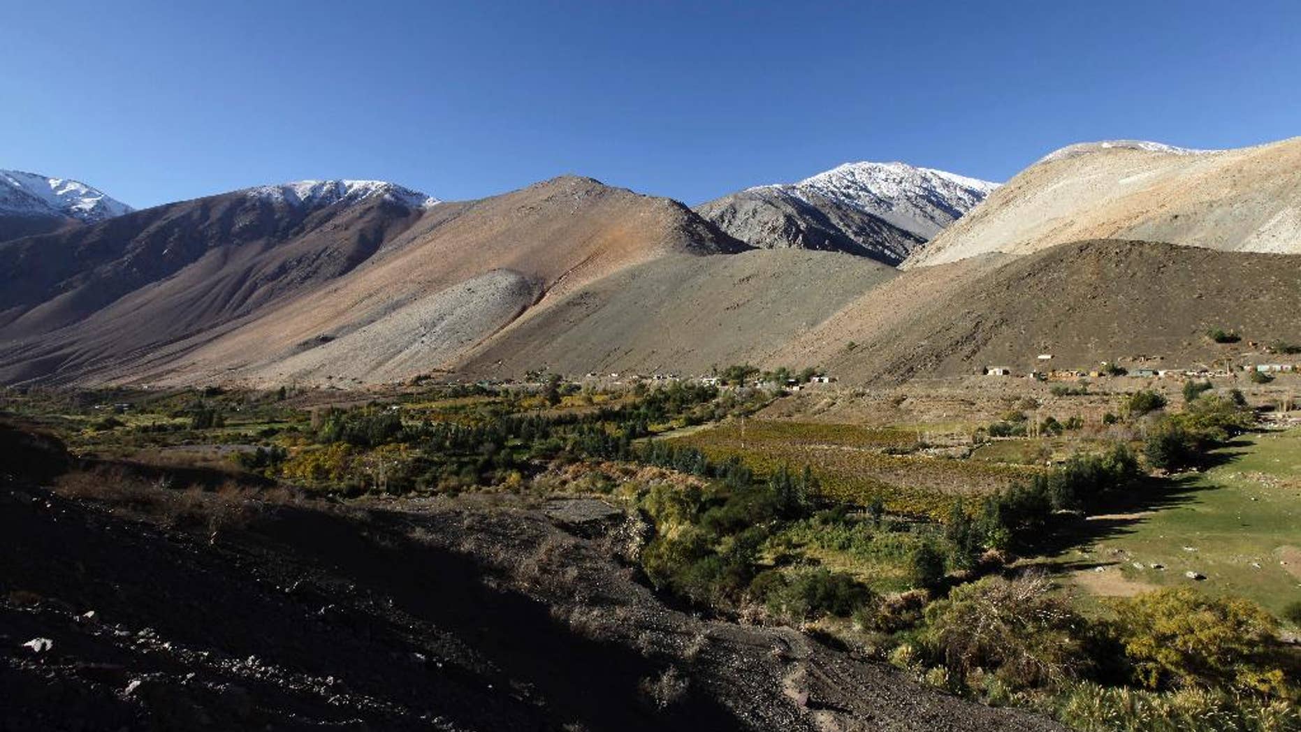 FILE - This May 23, file 2013 photo, shows El Corral, a village of 200 inhabitants, mostly from the Diaguita ethnic group, located just downstream from the world’s highest gold mine, Barrick Gold Corp's Pascua-Lama project in northern Chile. Barrick Gold said on Wednesday May 28, 2014, that it has reached an initial deal with a Chilean indigenous group opposed to its Pascua-Lama mine high in the Andes, with the goal of restarting stalled construction. (AP Photo/Jorge Saenz,File)