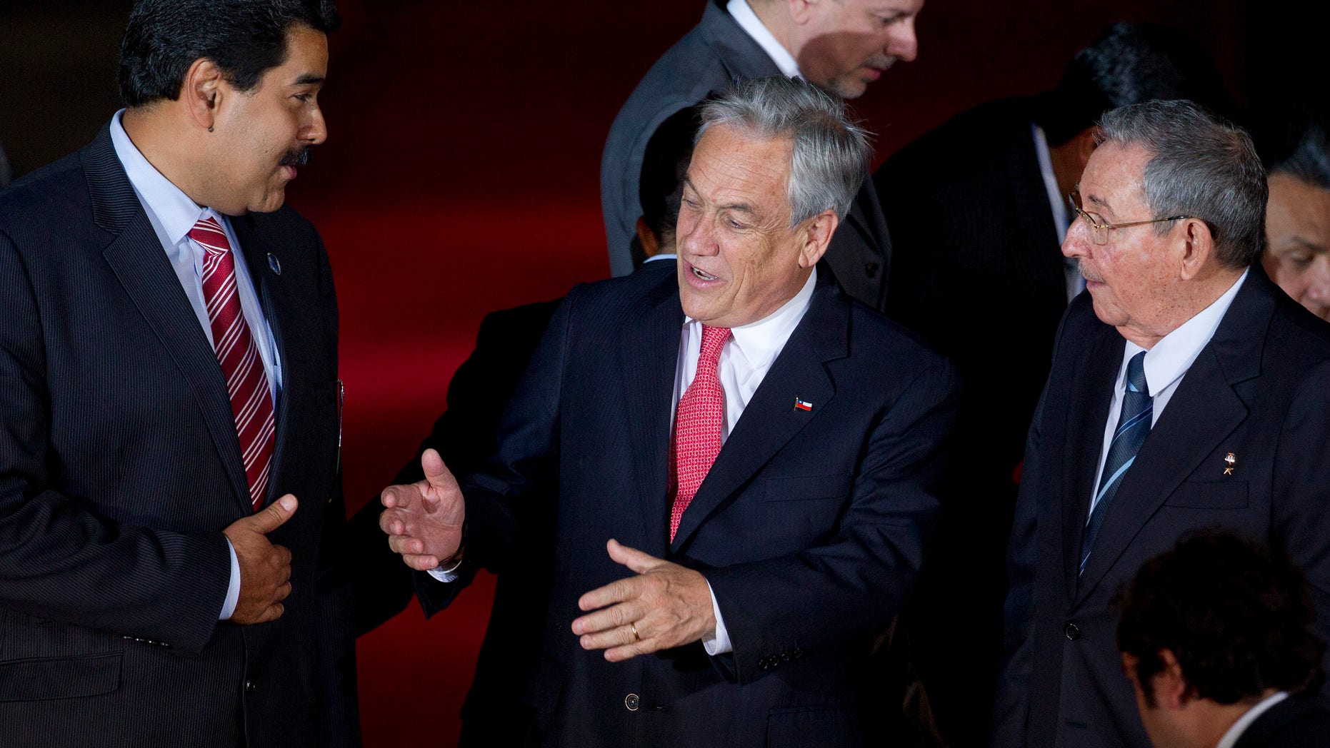 Jan. 27, 2013 - Chile's President Sebastian Pinera, center, speaks with Cuba's President Raul Castro, right, and Venezuela's Vice President Nicolas Maduro, left, at CELAC (Community of Latin American and Caribbean Countries) summit in Santiago, Chile.