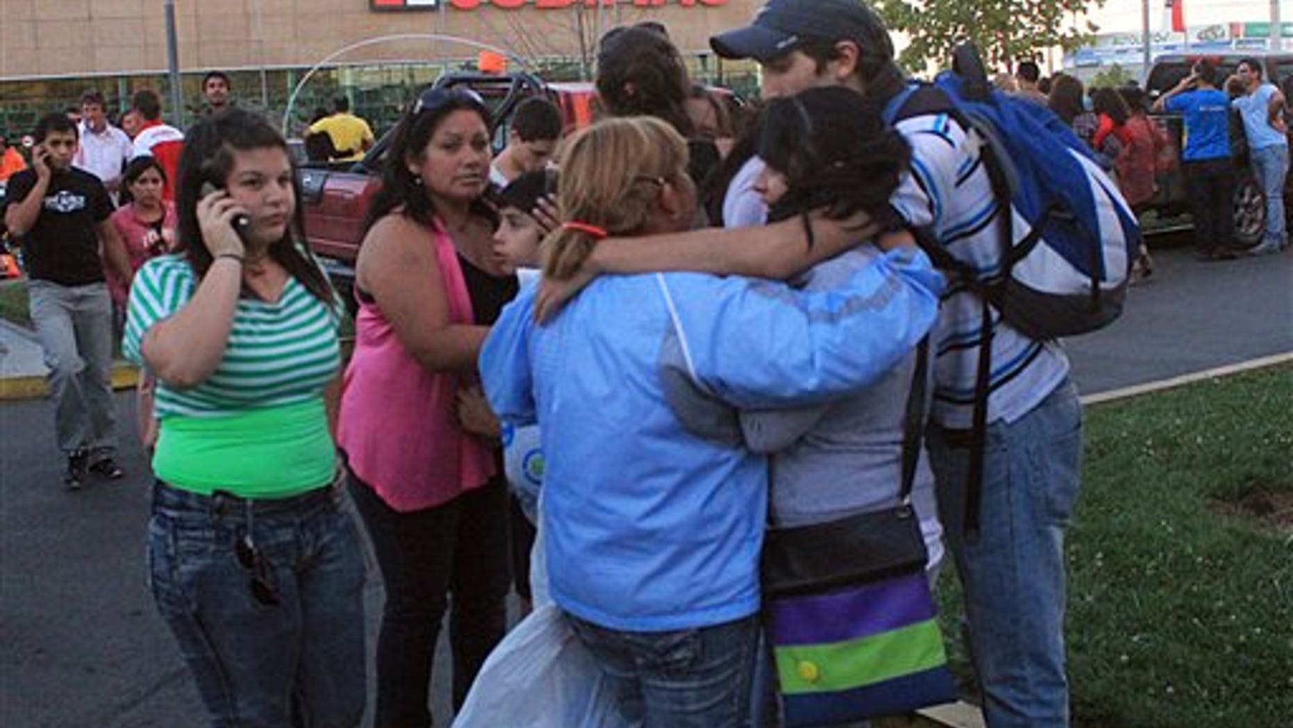 March 25: People gather outside a supermarket after an earthquake was felt in Talca, Chile.