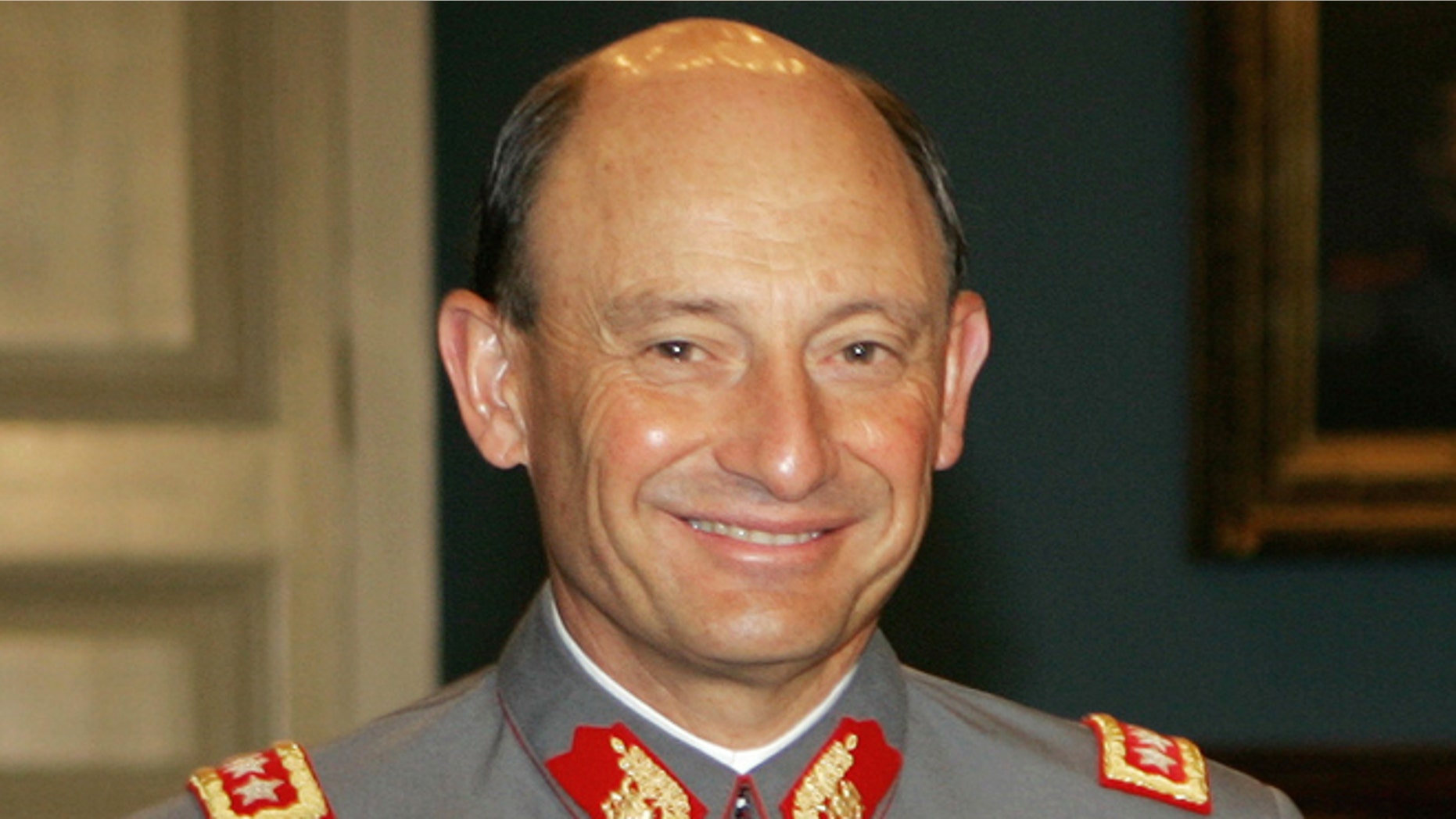 FILE - This Nov. 28, 2005 file photo, shows Chile's outgoing Army Chief Gen. Juan Emilio Cheyre at the government palace La Moneda, in Santiago, Chile. The former army chief acknowledged on Tuesday, Aug. 20, 2013, that he handed over to nuns the child of two left-wing activists killed after the 1973 military coup. Cheyre, who now heads Chile's electoral service, told the newspaper El Mercurio that he gave 2-year-old Ernesto Lejderman to a convent. In his first time speaking publicly about the case, he said that he was just following orders and that his conscience is clean. (AP Photo/Santiago Llanquin, File)