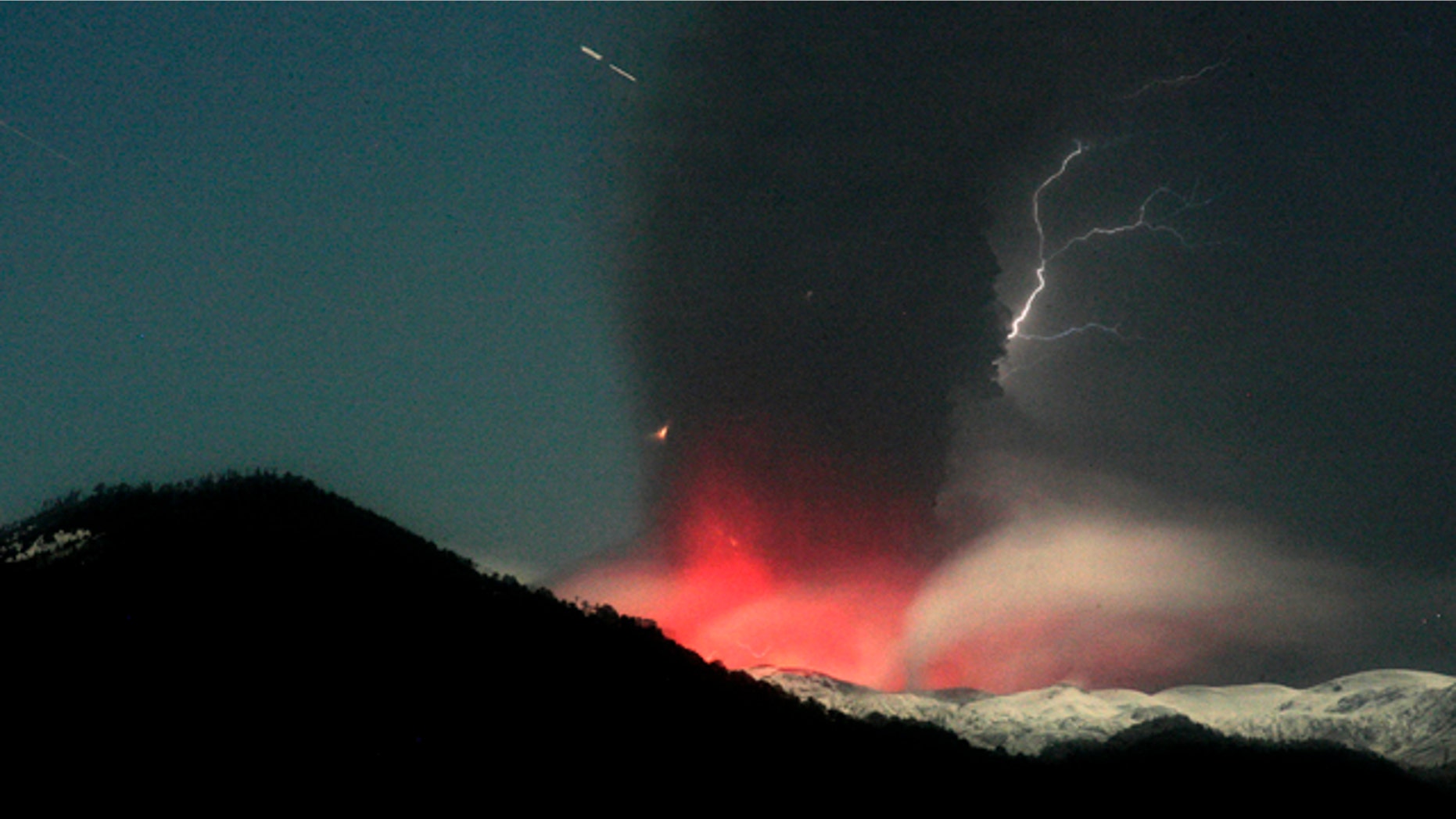 June 12: Lightning strikes over the Puyehue-Cordon Caulle volcano in Chile, seen from the international cross border way Cardenal Samore, in southern Chile. The volcano erupted June 4 after remaining dormant for decades.