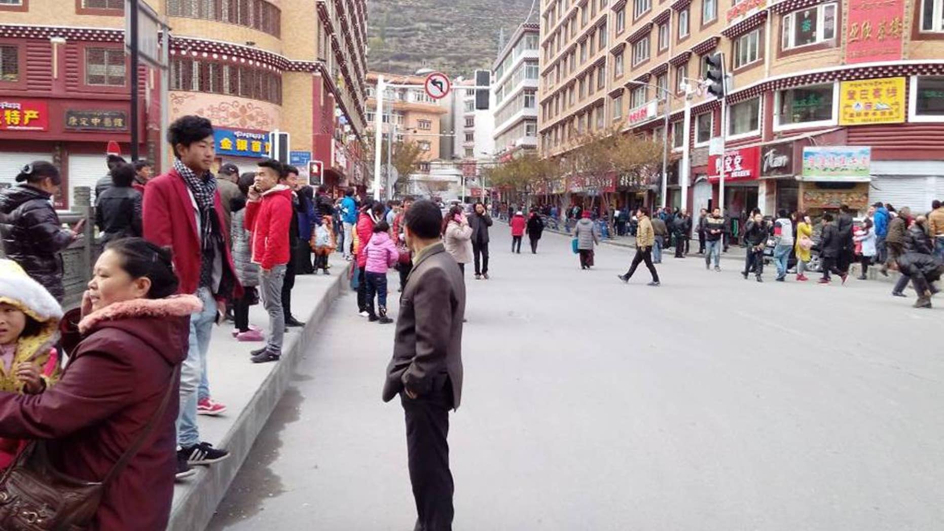 In this Saturday, Nov. 23, 2014 photo, injured people receive medical treatment at a hospital in Kangding County, Sichuan province, China. A strong earthquake that hit a sparsely populated, mountainous area of western China killed at least five people and injured more than 50 others, officials said Sunday. (AP Photo/Xinhua, Li Qiaoqiao) NO SALES