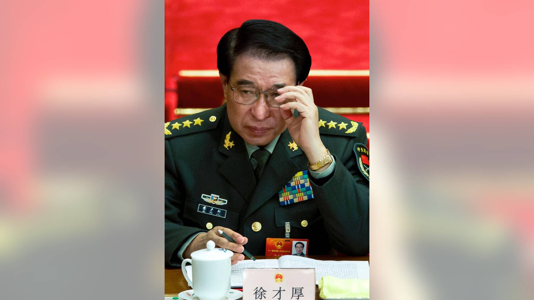 FILE - In this March 11, 2012 file photo, Xu Caihou, then deputy chairman of the Communist Party of China (CPC) Central Military Commission, which controls China's military, attends a plenary session of the National People's Congress at the Great Hall of the People in Beijing, China. Former No. 2 military official Xu, who was under investigation for alleged massive bribe-taking, has died in a hospital of cancer, the state Xinhua News Agency reported early Monday, March 16, 2015. He was 71.(AP Photo/Andy Wong, File)