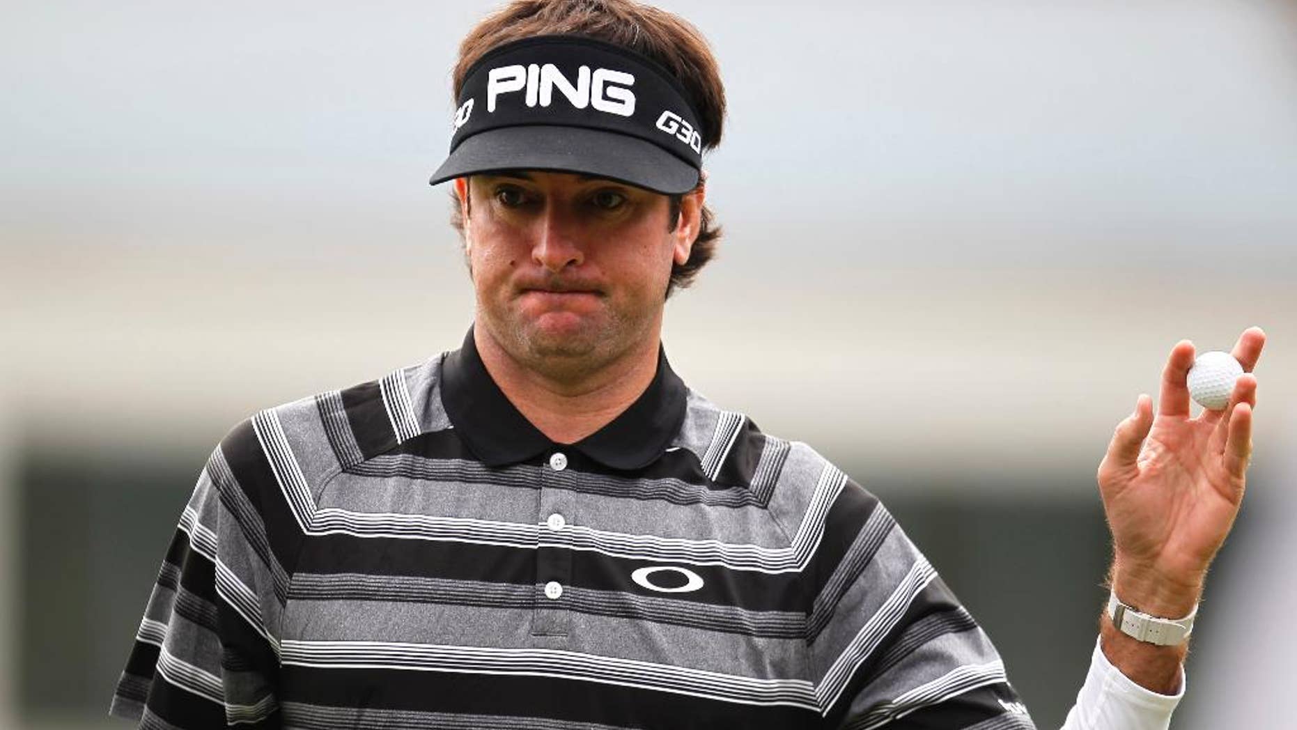 Bubba Watson of the U.S. greets spectators on the 4th hole during final round of the HSBC Champions golf tournament at the Sheshan International Golf Club in Shanghai, China, Saturday, Nov. 9, 2014. Watson captured his first World Golf Championship. (AP Photo)