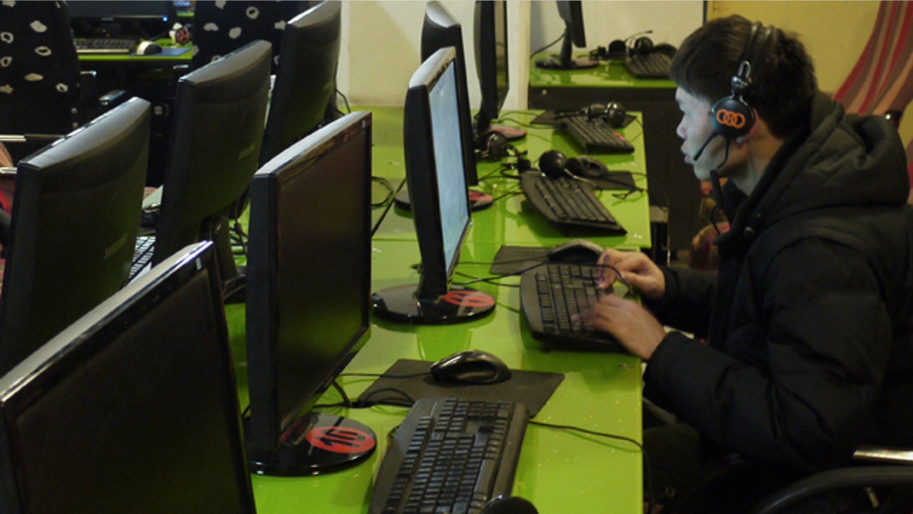 Surfing the Internet inside an Internet cafe in Dunhuang, in northwest China's Gansu province.