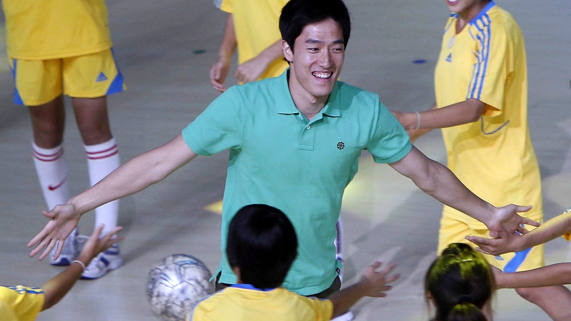 June 10, 2012: In this photo, Chinese hurdler Liu Xiang participates in the opening ceremony of the 1st Shanghai Citizen's Games in Shanghai, China.