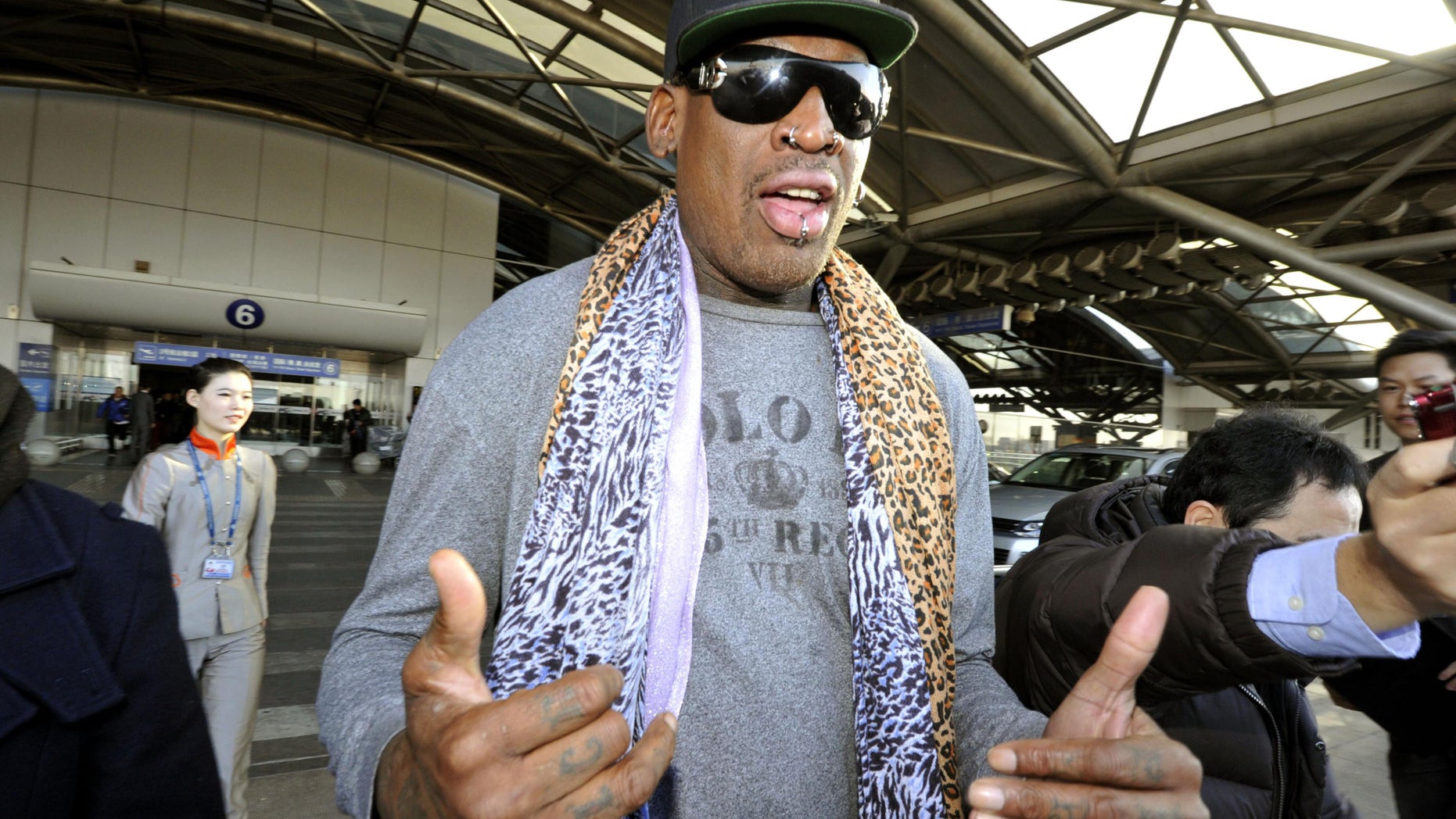 Dec. 23, 2013 - Former basketball star Dennis Rodman speaks to journalists upon arrival at the capital airport in Beijing from Pyongyang, North Korea. Rodman left North Korea Monday, but didn't answer questions on whether he met with leader Kim Jong Un on his latest visit.