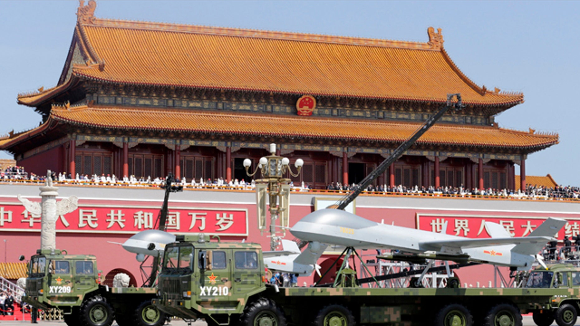 Sept. 3, 2015: Chinese military vehicles carry Pterodactyl I unmanned aerial vehicles past the Tiananmen Gate during a military parade to commemorate the 70th anniversary of the end of World War II in Beijing. (Jason Lee/Pool Photo via AP)