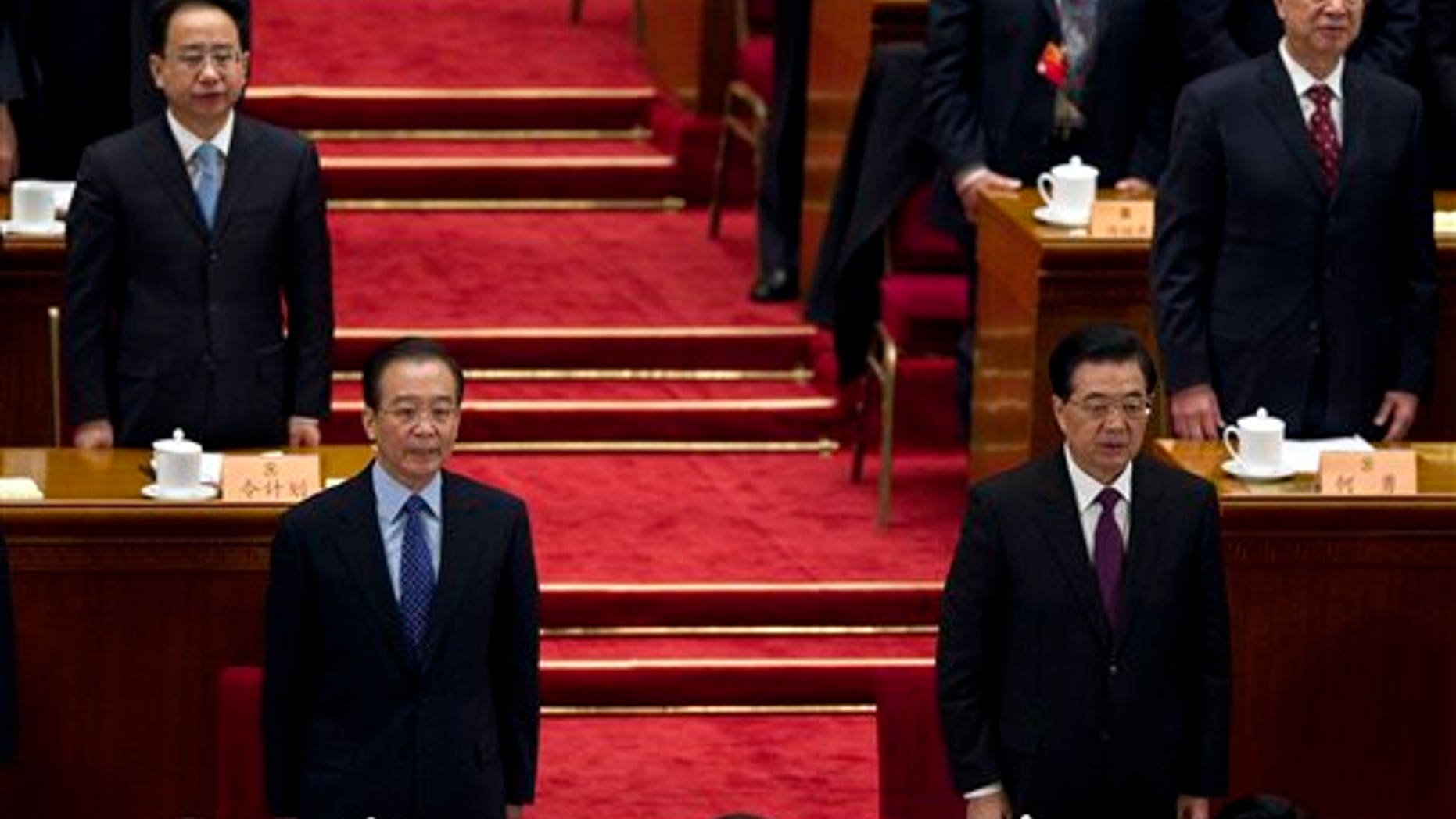 March 13: Chinese President Hu Jintao, front right, and Chinese Premier Wen Jiabao, front left, sing Chinese national anthem with delegates and other leaders during the closing session of the Chinese People's Political Consultative Conference held in Beijing's GreatHall of the People, China.