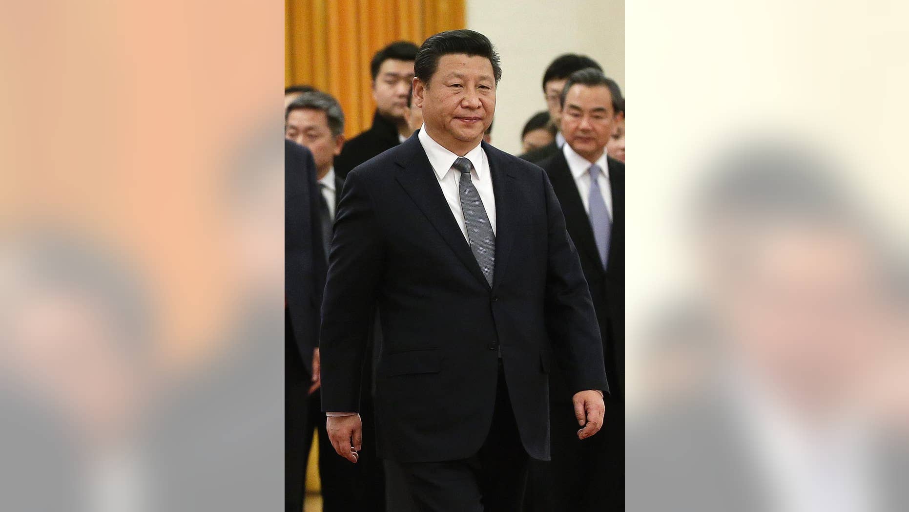 In this Jan. 7, 2015 photo, Chinese President Xi Jinping walks during a welcome ceremony for Venezuela's President Nicolas Maduro at the Great Hall of the People in Beijing, China. Xi's base salary is rising from about $13,600 to $22,300 a year under a recent general pay increase for public employees, state media reported Tuesday, Jan. 20. (AP Photo/Andy Wong)