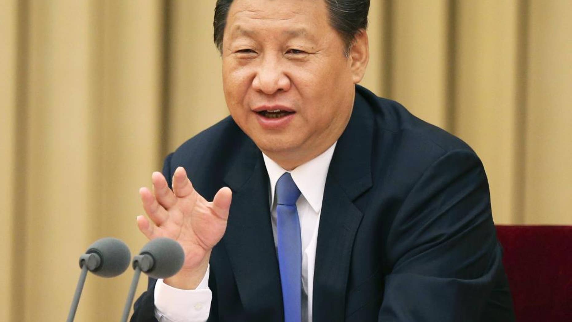 In this photo released by China's Xinhua News Agency, Chinese President Xi Jinping addresses a high-level party meeting that sought to unite non-Communist Party groups and individuals in Beijing Wednesday, May 20, 2015. Xi warned that religions must be independent from foreign influence, as the government asks domestic religious groups to pledge loyalty to the state. China is ruled by the officially atheist Communist Party, and Beijing attempts to control a variety of religions and their spread. (Ma Zhancheng/XInhua via AP) NO SALES