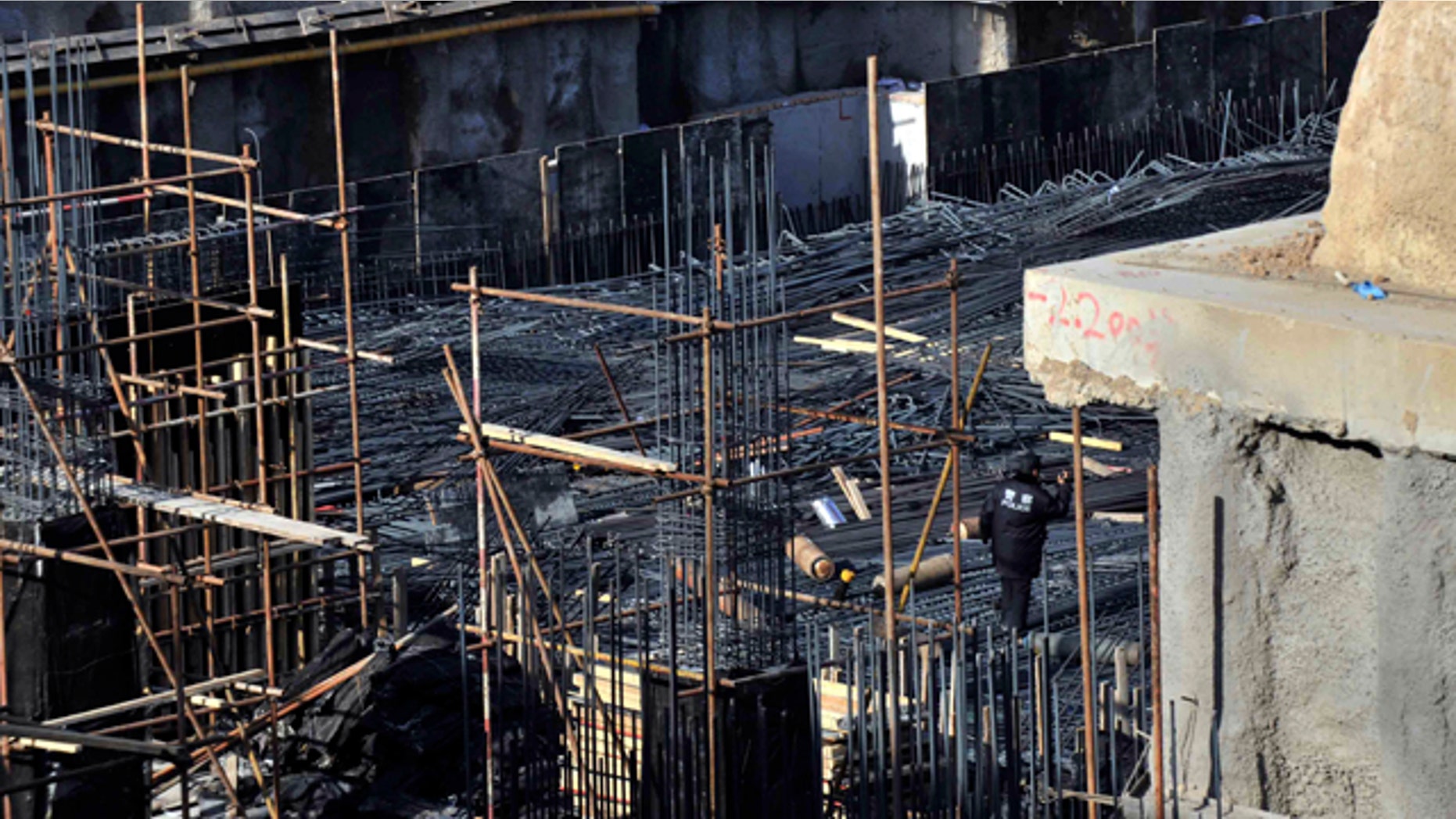 Dec. 29, 2014: This photo released by China's Xinhua News Agency shows the construction site where a scaffolding collapsed in the Tsinghua High School in Beijing. (AP Photo/Xinhua, Li Wen)