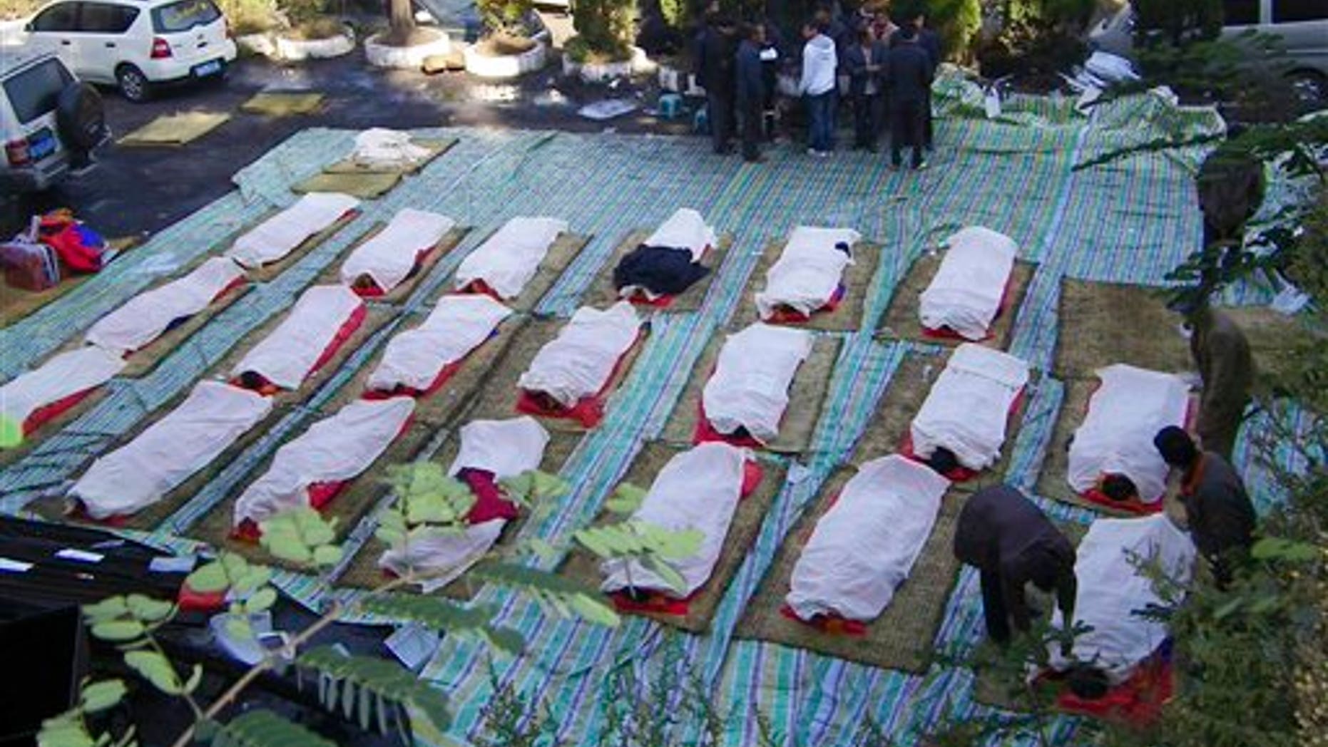 November 11: Relatives identify bodies of killed miners at the Sizhuang Coal Mine after a gas leak in Shizong county of Qujing city, in southwest China's Yunnan province.