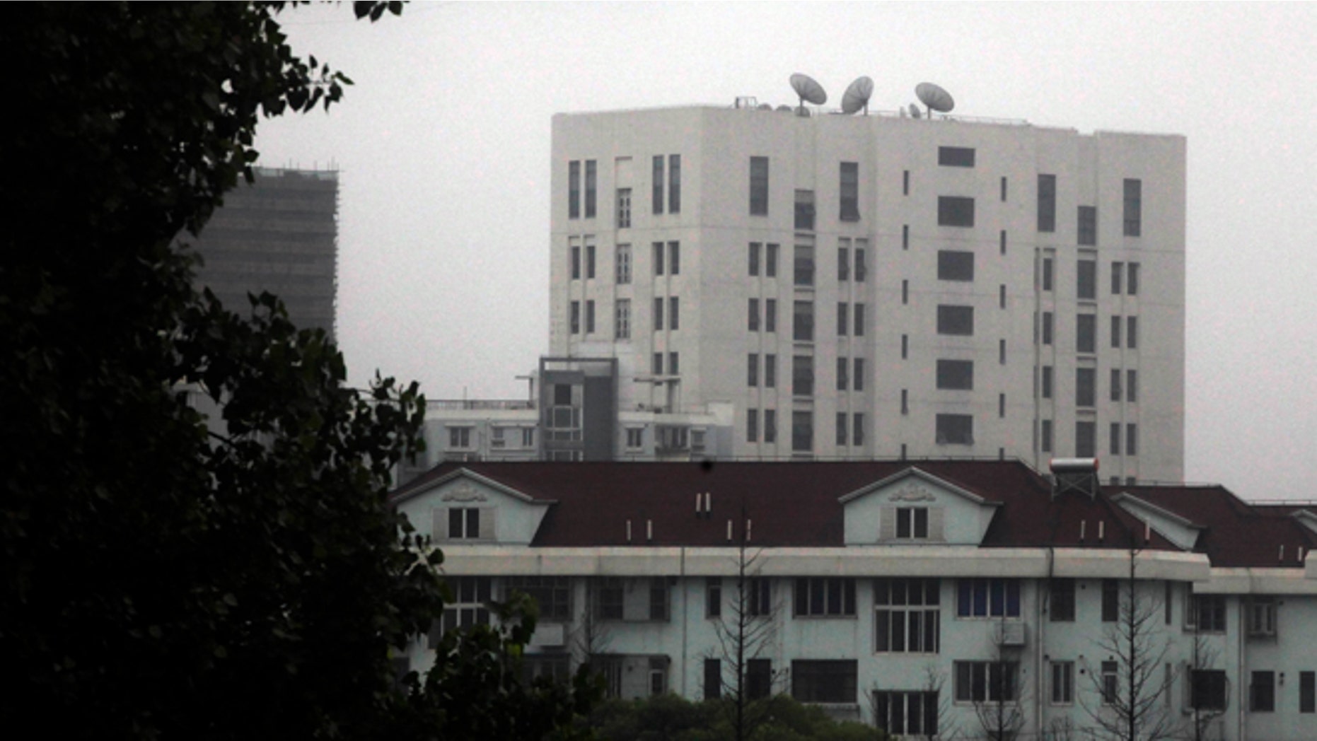 May 31, 2013: This file photo shows the building housing Unit 61398 of the Peoples Liberation Army, center top, on the outskirts of Shanghai, China. A U.S. security firm, Mandiant, said last year it traced attacks on American and other companies to the military unit in Shanghai. China on Tuesday, May 20, 2004, warned the United States was jeopardizing military ties by charging five Chinese officers with cyberspying and tried to turn the tables on Washington by calling it "the biggest attacker of China's cyberspace." (AP)