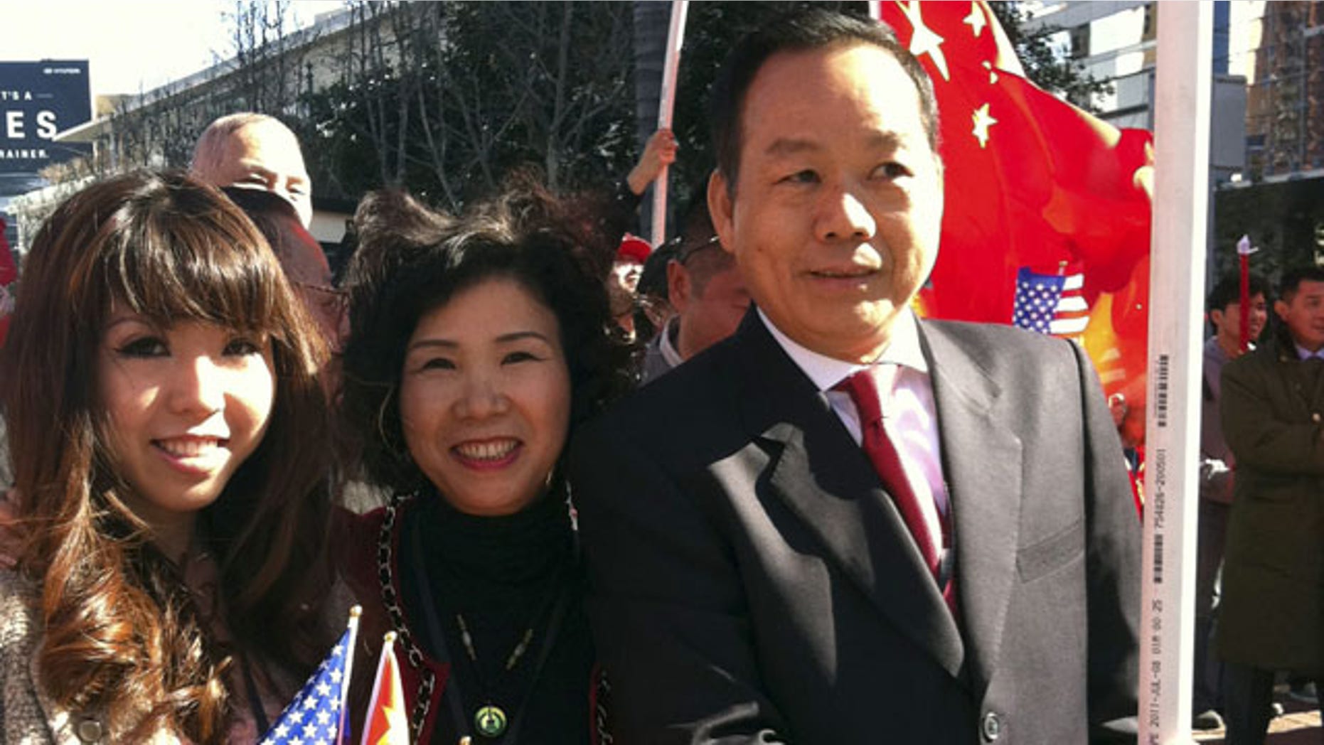 FILE - In this Feb. 16, 2012 file photo released by Anna Wu, American businessman Vincent Wu, right, poses for a photo with his wife Yip Lai Fong, center, and daughter Anna Wu as they wait to welcome China's then-Vice President Xi Jinping on his visit to Los Angeles, Calif. (AP)