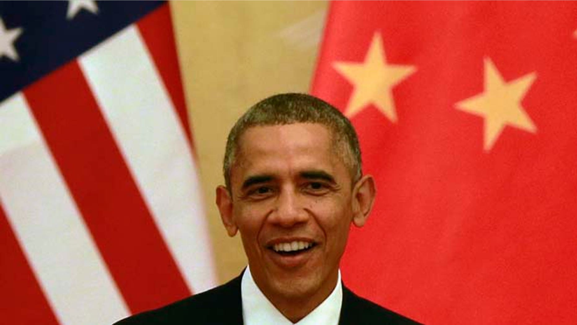 This Wednesday, Nov. 12, 2014 photos shows U.S. President Barack Obama during a joint press conference with Chinese President Xi Jinping at the Great Hall of the People in Beijing.