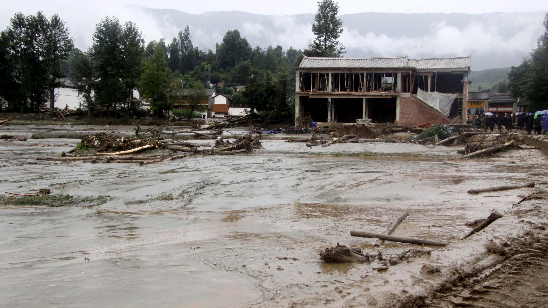Aug. 6, 2012: In this photo released by China's Xinhua News Agency, mud covers the area after a mudslide in Tiejia Village of Eryuan County of Dali Bai Autonomous Prefecture, southwest China's Yunnan Province.