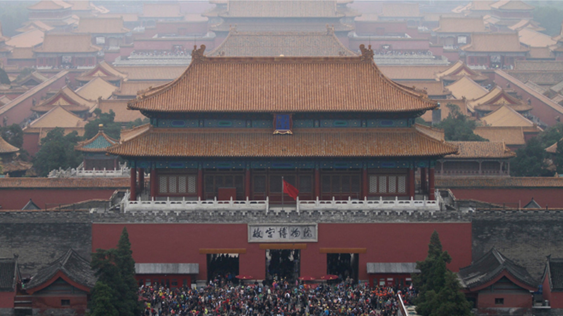 This Oct. 3, 2014 file photo shows tourists at the Forbidden City in Beijing, China.