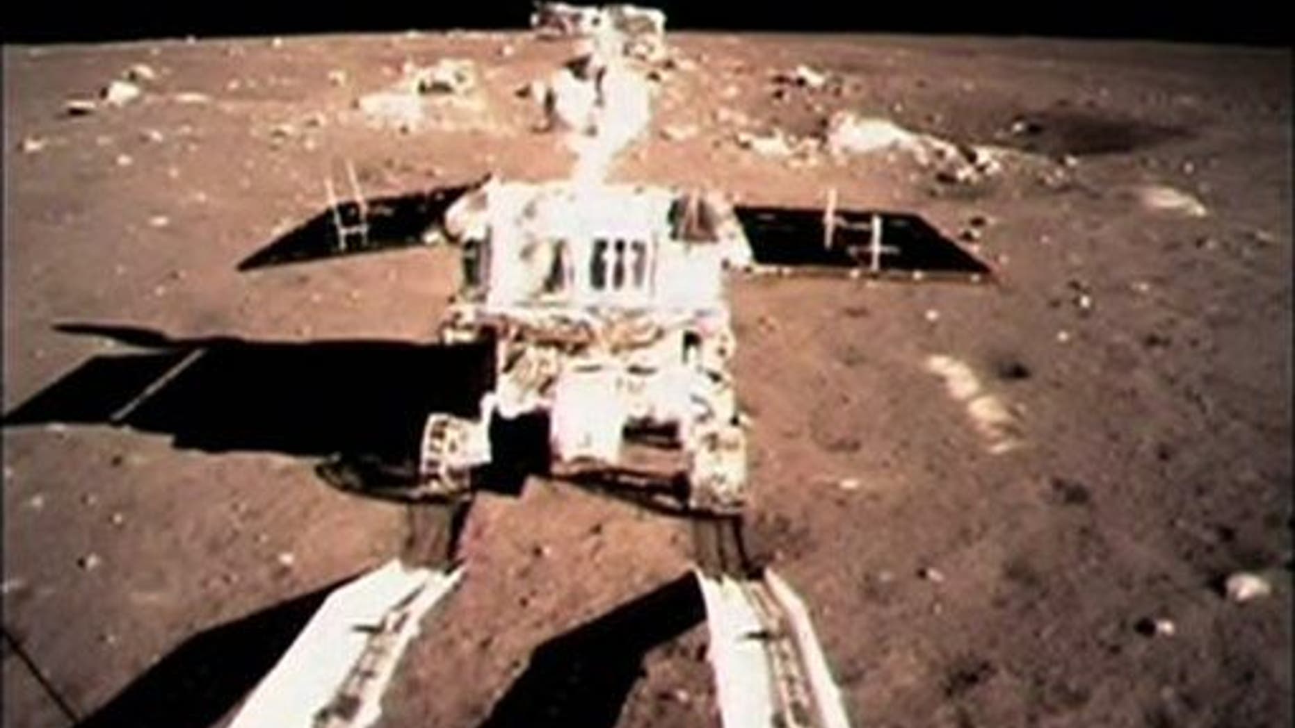 In this image taken by the on-board camera of the lunar probe Chang'e-3, China's first moon rover "Jade Rabbit" touches the lunar surface Sunday, Dec. 15, 2013.
