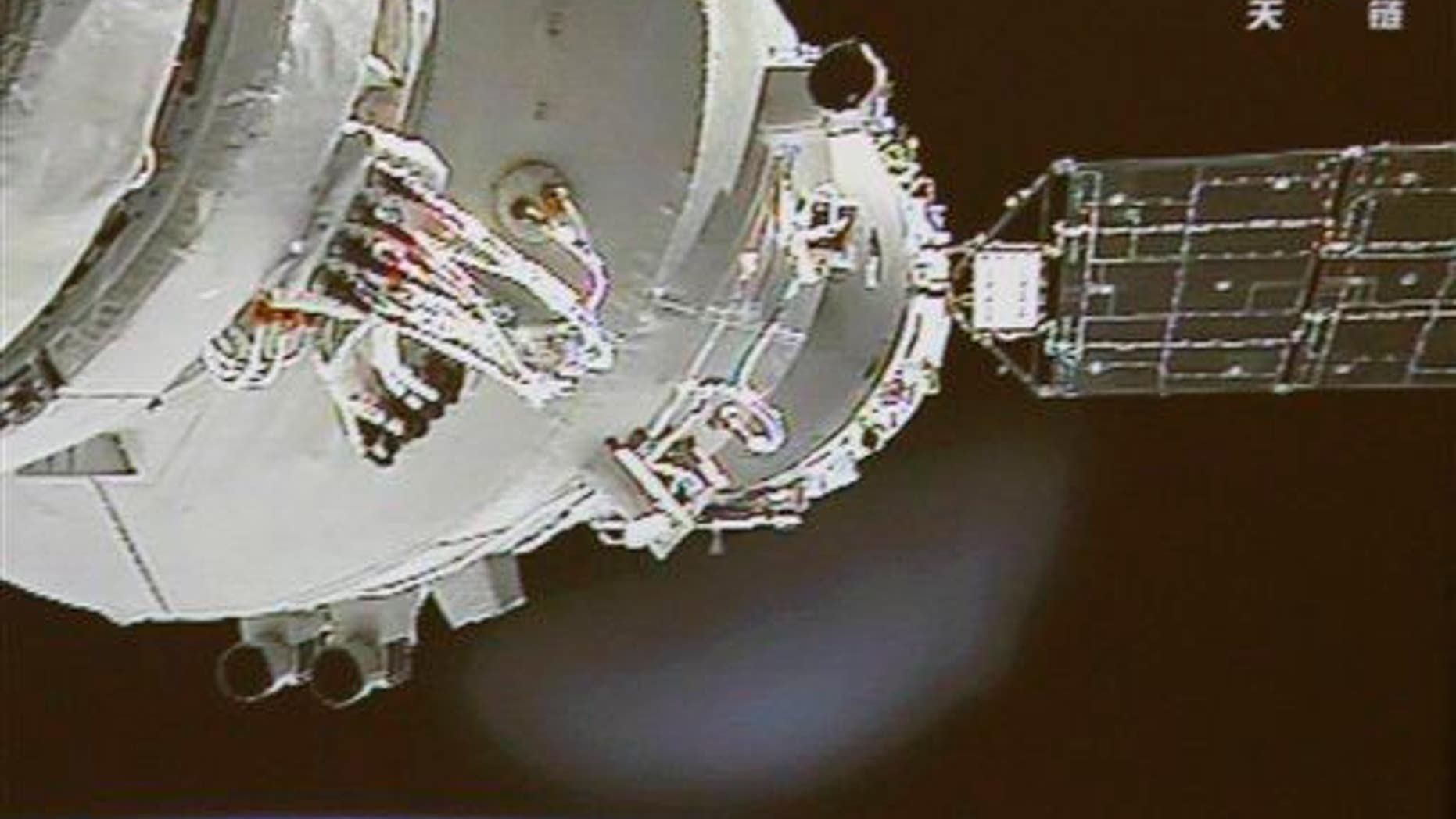 The Shenzhou-9 spacecraft docks with the Tiangong-1 space lab in 2012. The lab is currently falling back to Earth and is scheduled to burn up in the atmosphere sometime in the second half of 2017.