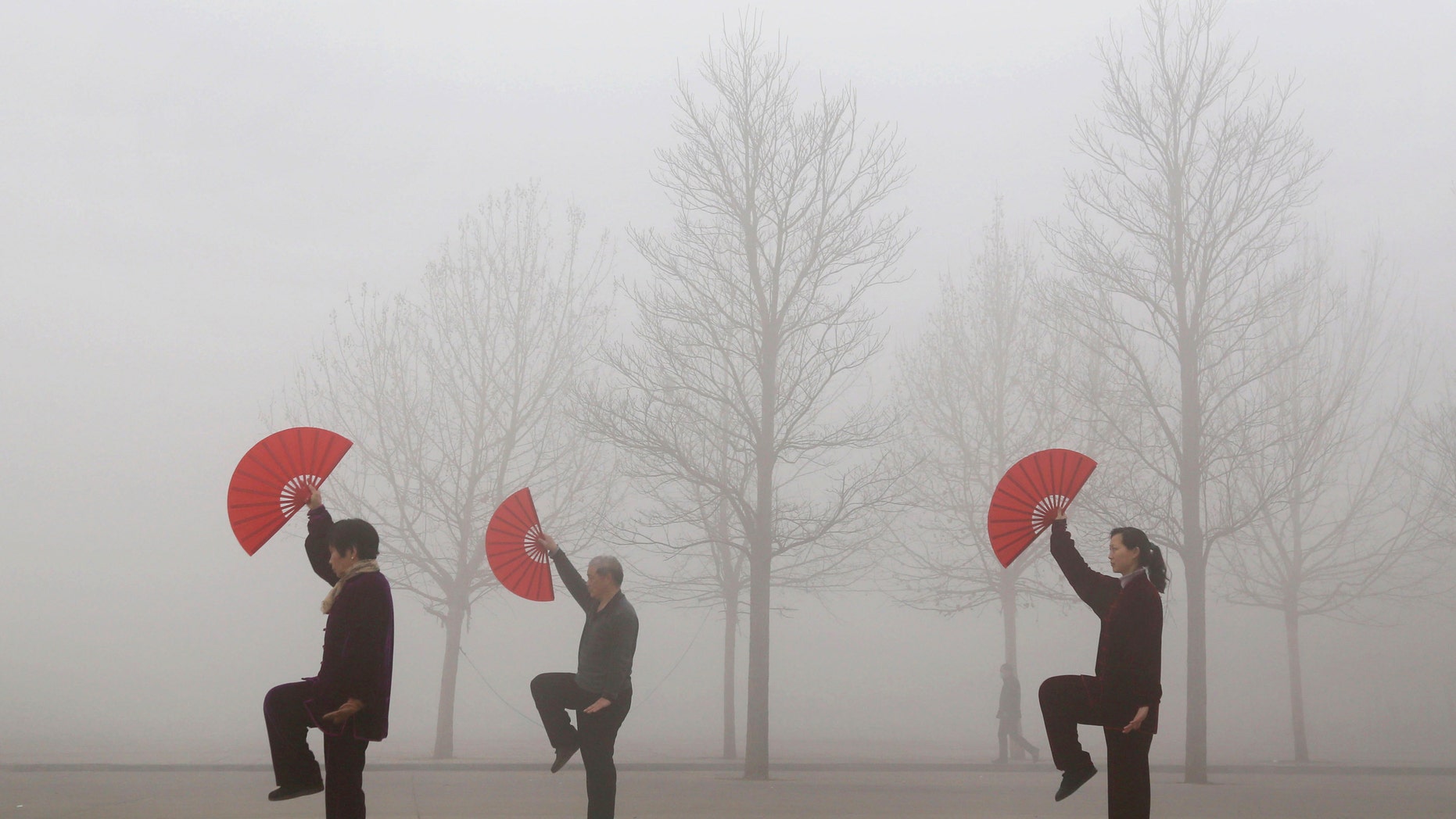 March 16, 2015: People do morning exercises on a polluted day in Jiaozuo, Henan province.