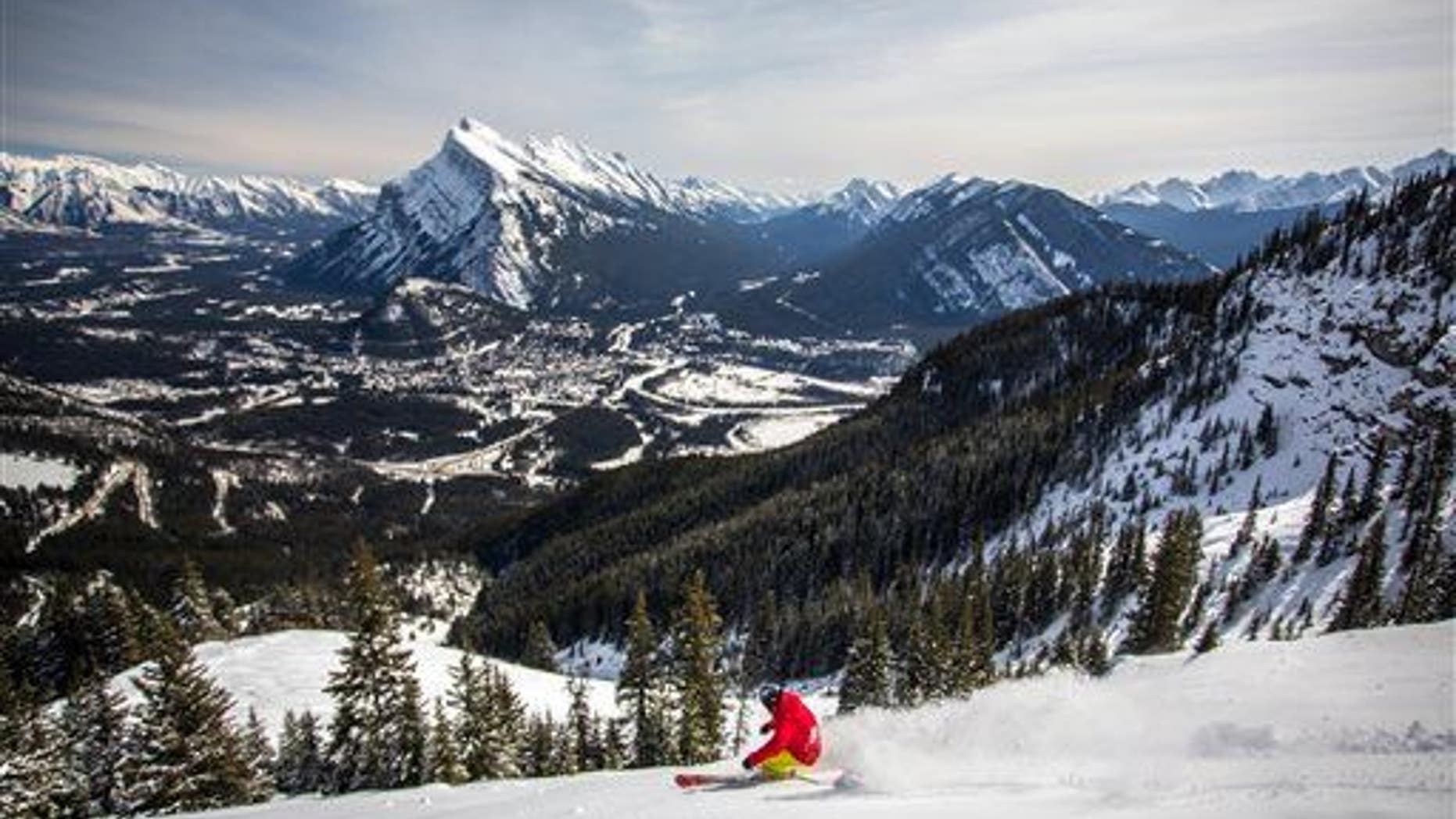 A snowboarder on the mountain in the Canadian Rockies, just 15 minutes from Banff, Alberta.