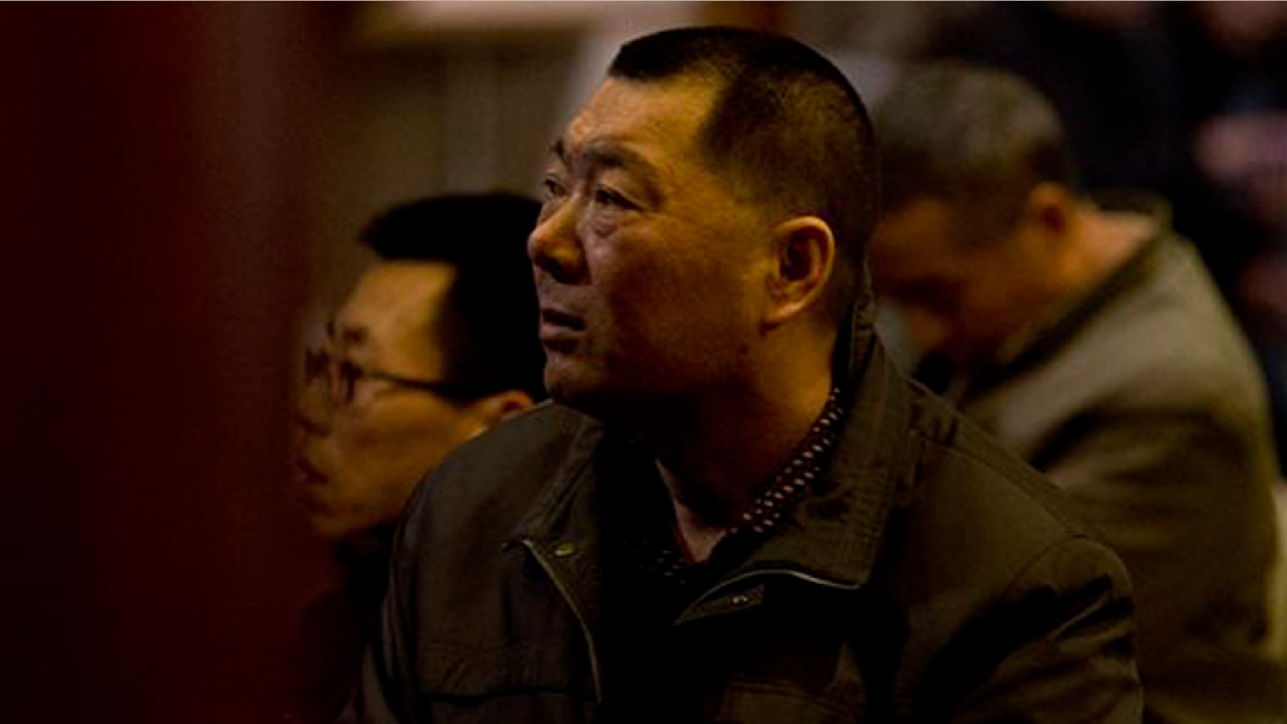 Relatives of Chinese passengers aboard the missing Malaysia Airlines Flight MH370 watch a TV news program about the plane as they wait for a news briefing by the Airlines' officials at a hotel ballroom in Beijing, China, Tuesday, March 18, 2014. Families of the passengers aboard the missing plane decided to organize a hunger strike to express their anger and disappointment at the handling of the situation by authorities. They decided on the action after a daily morning meeting with two officials from Malaysia Airlines. The plane has been missing since March 8, and contradictory information plus the fact there has been no sign of the plane has left family members frustrated. (AP Photo/Andy Wong)