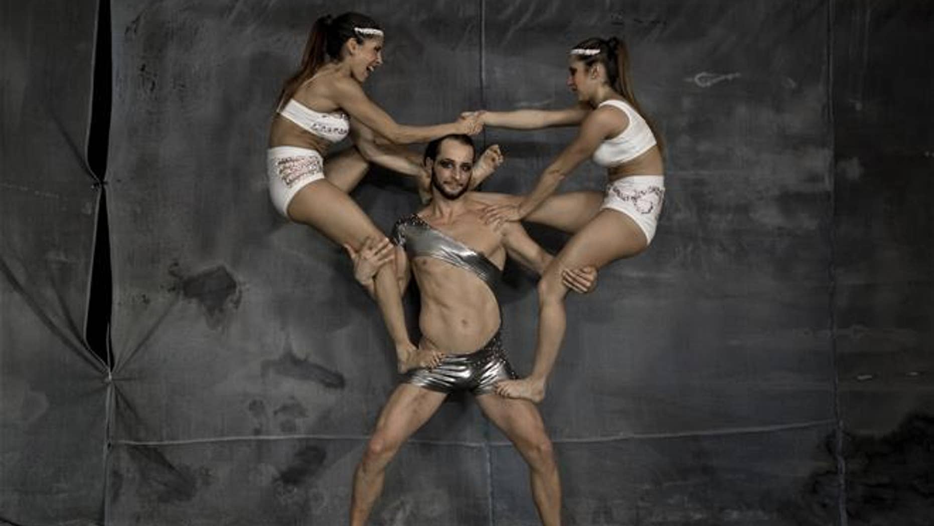In this Sept. 16, 2016 picture, Ana Sofia Bigliardo and Ana Laura Ruzicka get in position for a souvenir picture with Poland's Dave Skda at the Romania Pole Sport&Fitness World Championship in Bucharest, Romania. This is the time of year when people are most likely to weigh their lowest all year.