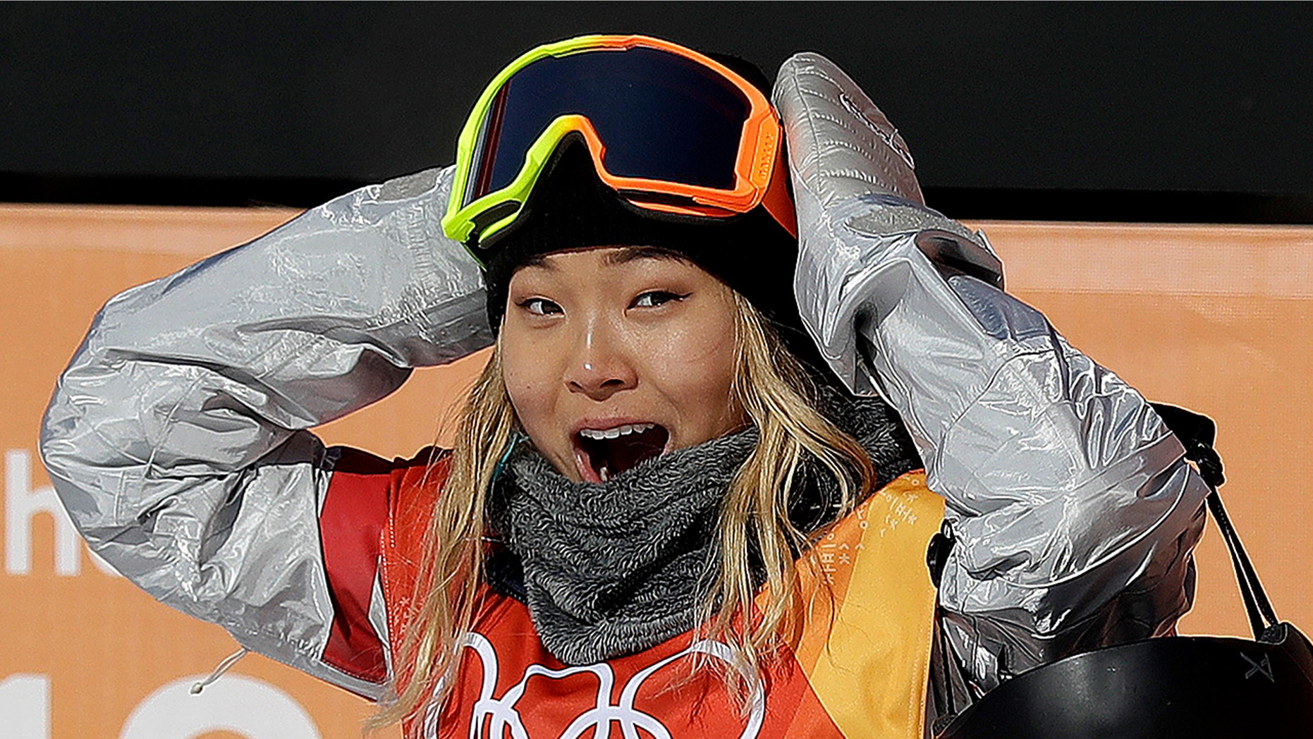 Chloe Kim, of the United States, reacts to her score during the women's halfpipe finals at Phoenix Snow Park at the 2018 Winter Olympics in Pyeongchang, South Korea, Tuesday, Feb. 13, 2018.