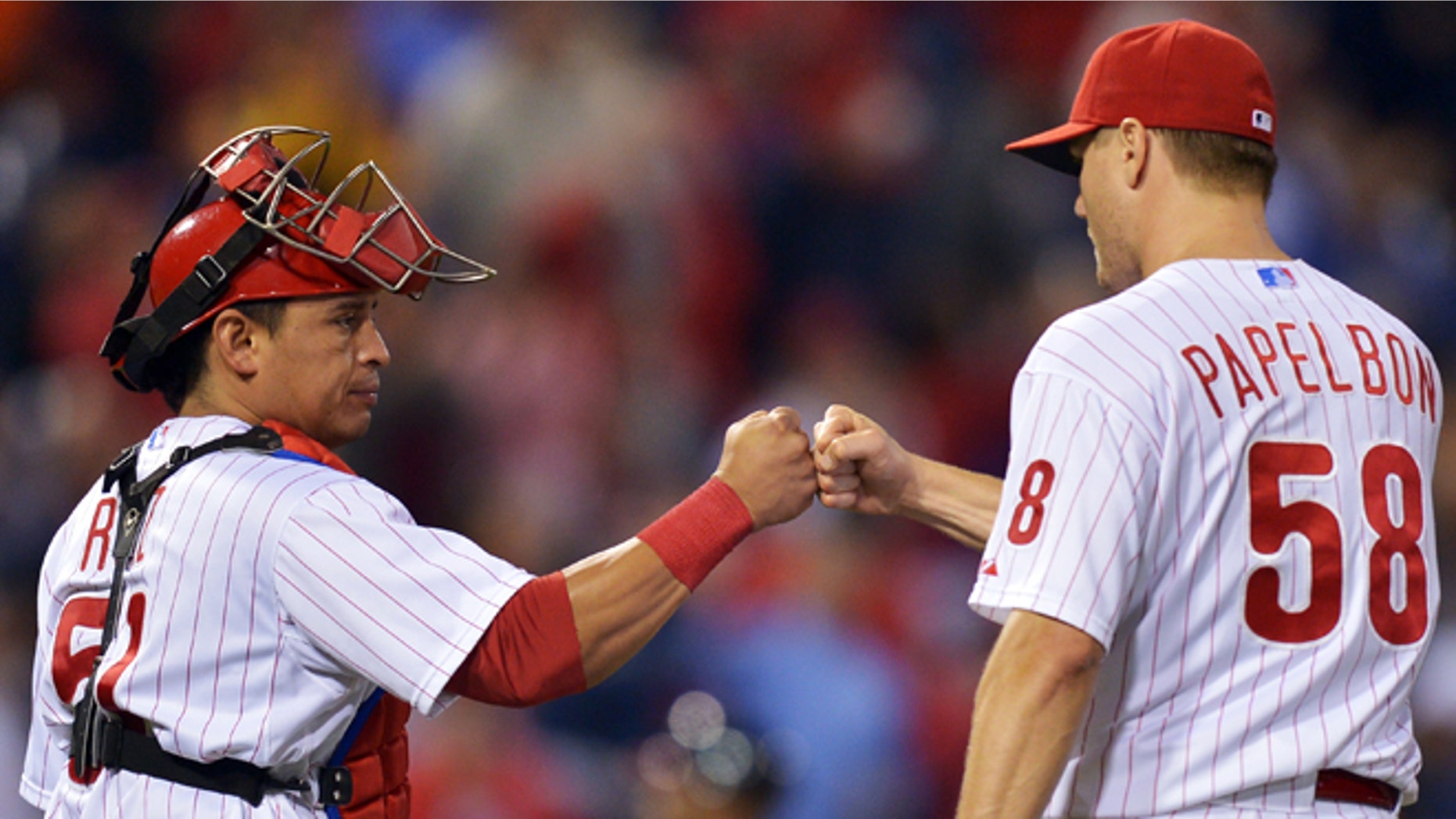 PHILADELPHIA, PA - SEPTEMBER 25: Carlos Ruiz #51 of the Philadelphia Phillies congratulates Jonathan Papelbon #58 after beating the Washington Nationals 6-3 at Citizens Bank Park on September 25, 2012 in Philadelphia, Pennsylvania. (Photo by Drew Hallowell/Getty Images)