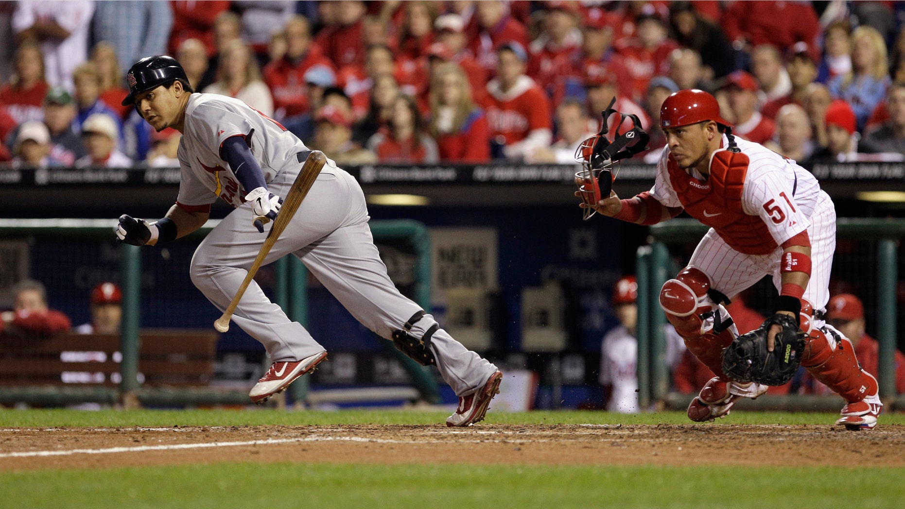 PHILADELPHIA, PA - OCTOBER 07: Jon Jay #19 of the St. Louis Cardinals runs out of the batter's box on a bunt attempt against Carlos Ruiz #51 of the Philadelphia Phillies during Game Five of the National League Divisional Series at Citizens Bank Park on October 7, 2011 in Philadelphia, Pennsylvania. (Photo by Rob Carr/Getty Images)
