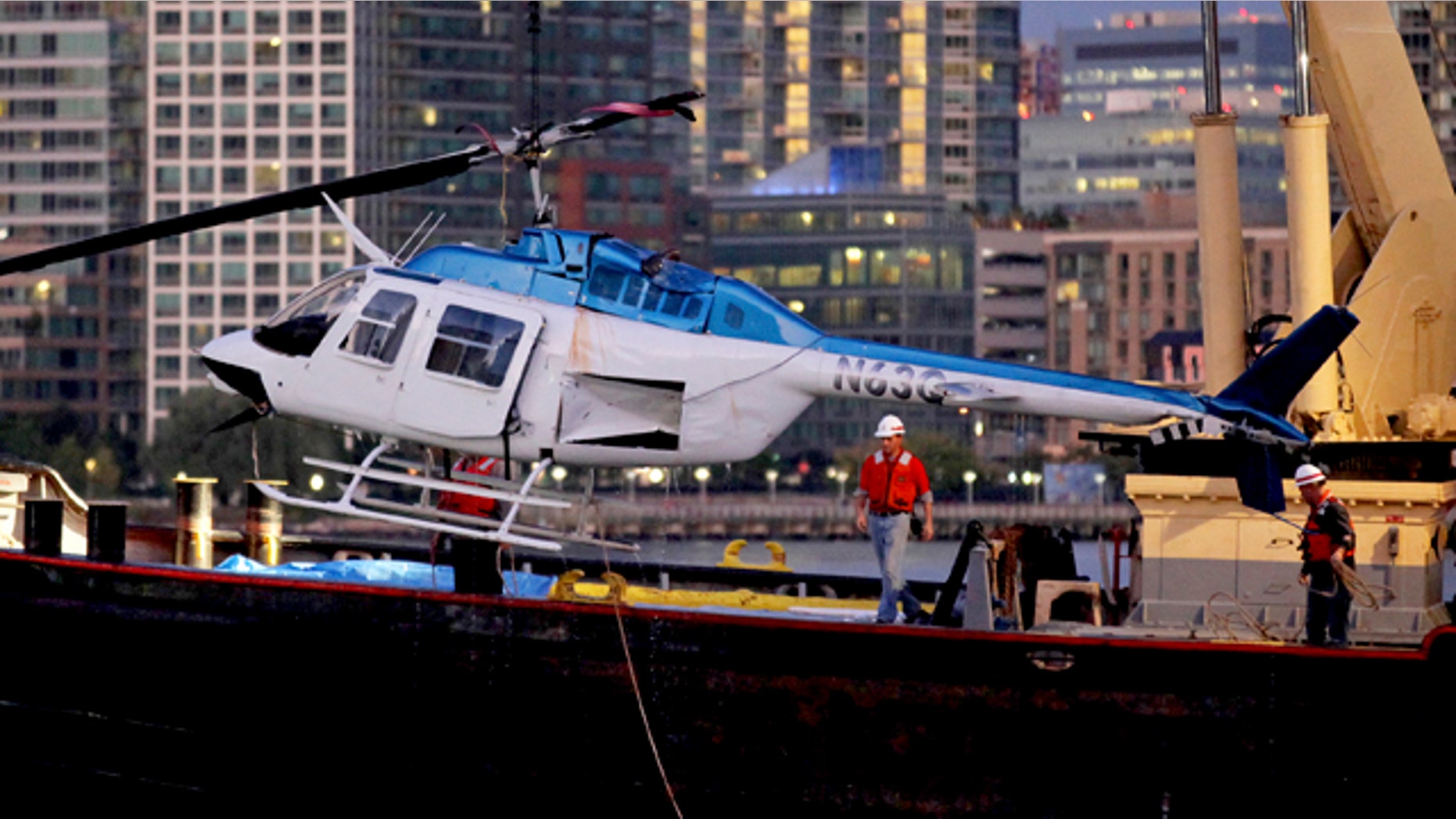 Oct. 4: A helicopter that crashed into the East River in New York is hoisted from the water.