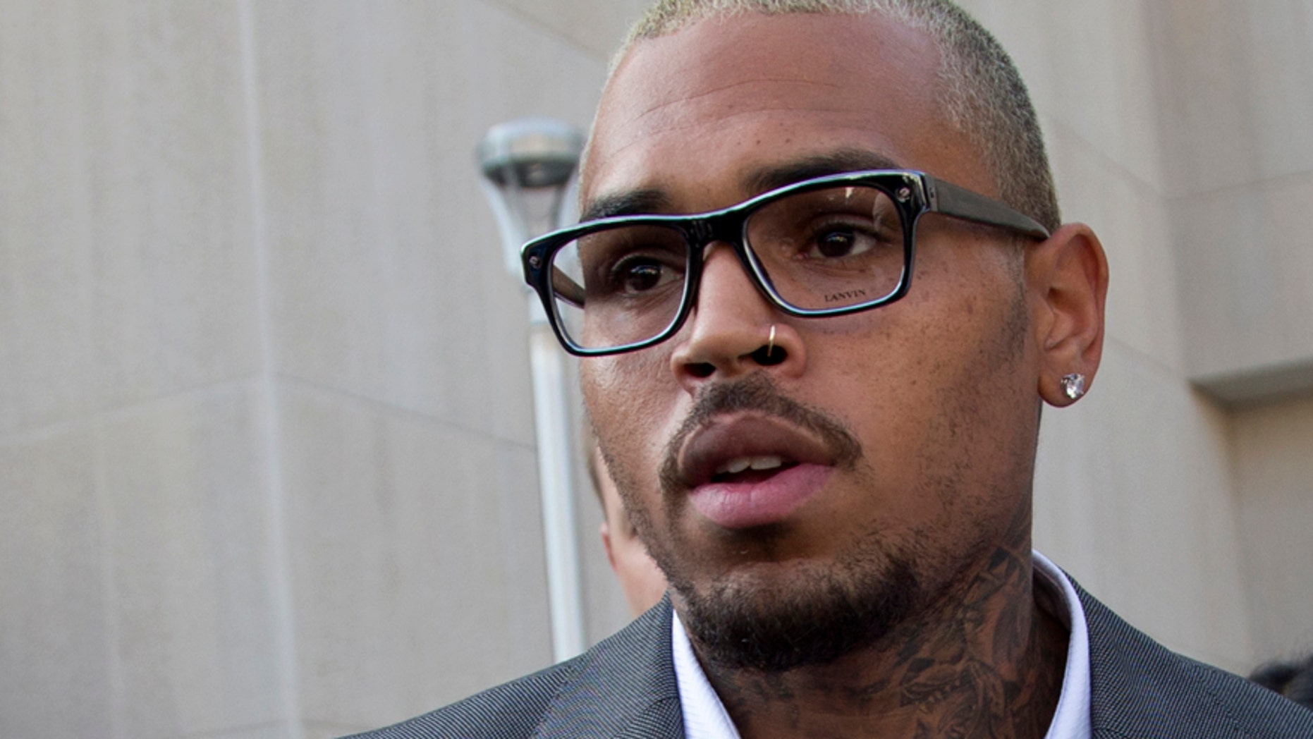 Singer Chris Brown leaves District of Columbia Superior Court in Washington, Tuesday, Sept. 2, 2014, after pleading guilty on a misdemeanor assault.