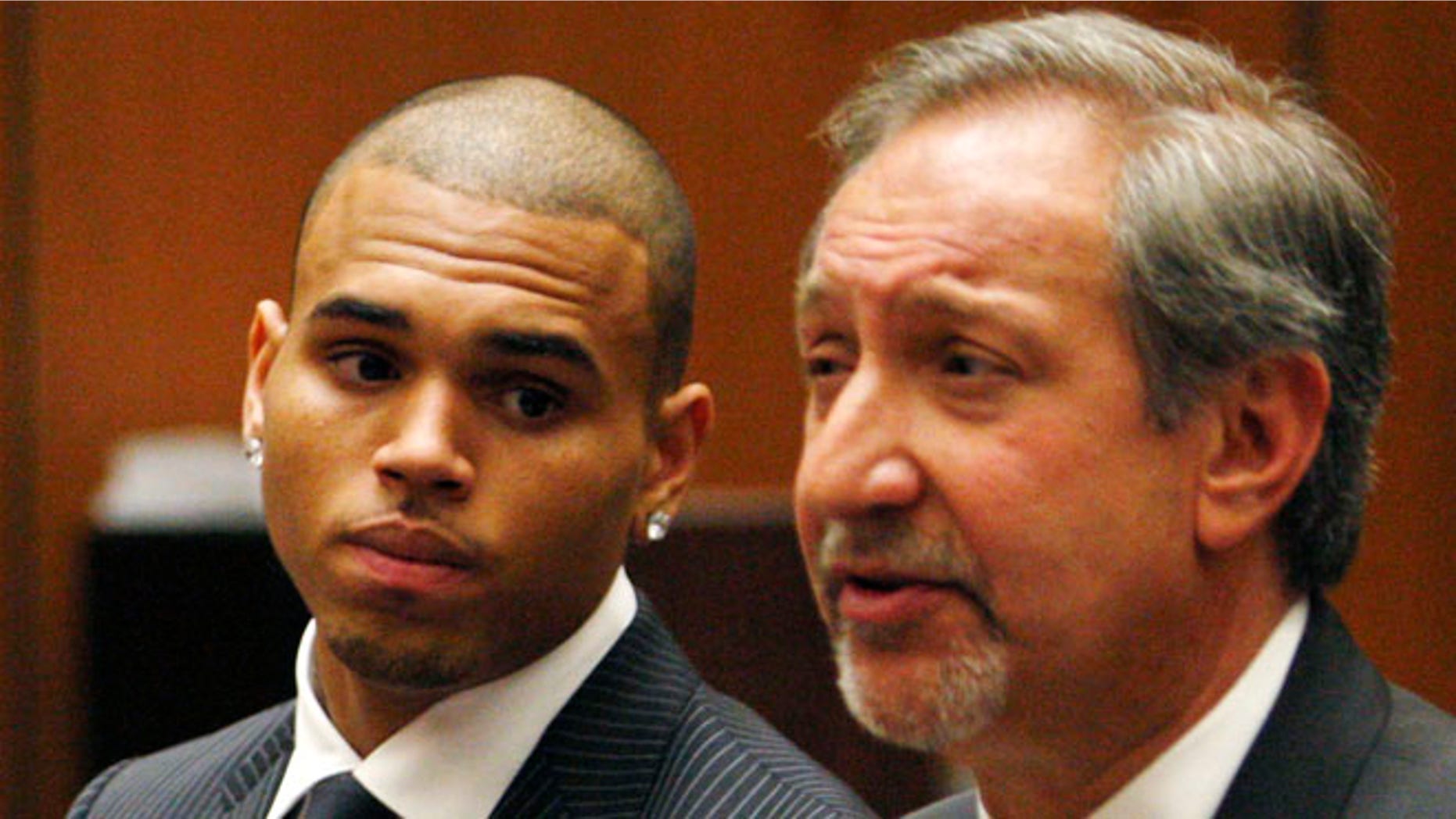 Aug. 25, 2009: In this file photo, Chris Brown looks on alongside his attorney Mark Geragos during his sentencing for assaulting his girlfriend Rihanna, at Los Angeles County Superior Court in Los Angeles.