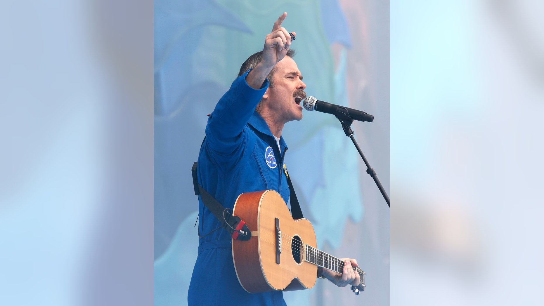 File photo - Chris Hadfield performs during Canada Day celebrations on Parliament Hill in Ottawa July 1, 2013.
