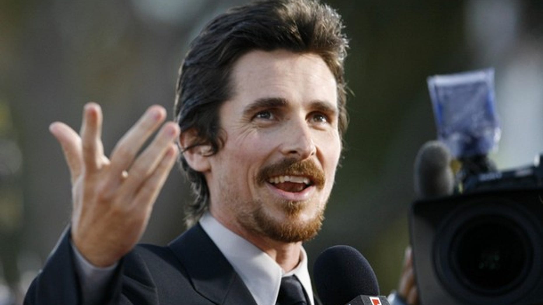 Cast member Christian Bale is interviewed at the premiere of the movie "Public Enemies" at the Mann Village theatre in Westwood, California June 23, 2009. The movie opens in the U.S. July 1. REUTERS/Mario Anzuoni (UNITED STATES ENTERTAINMENT)