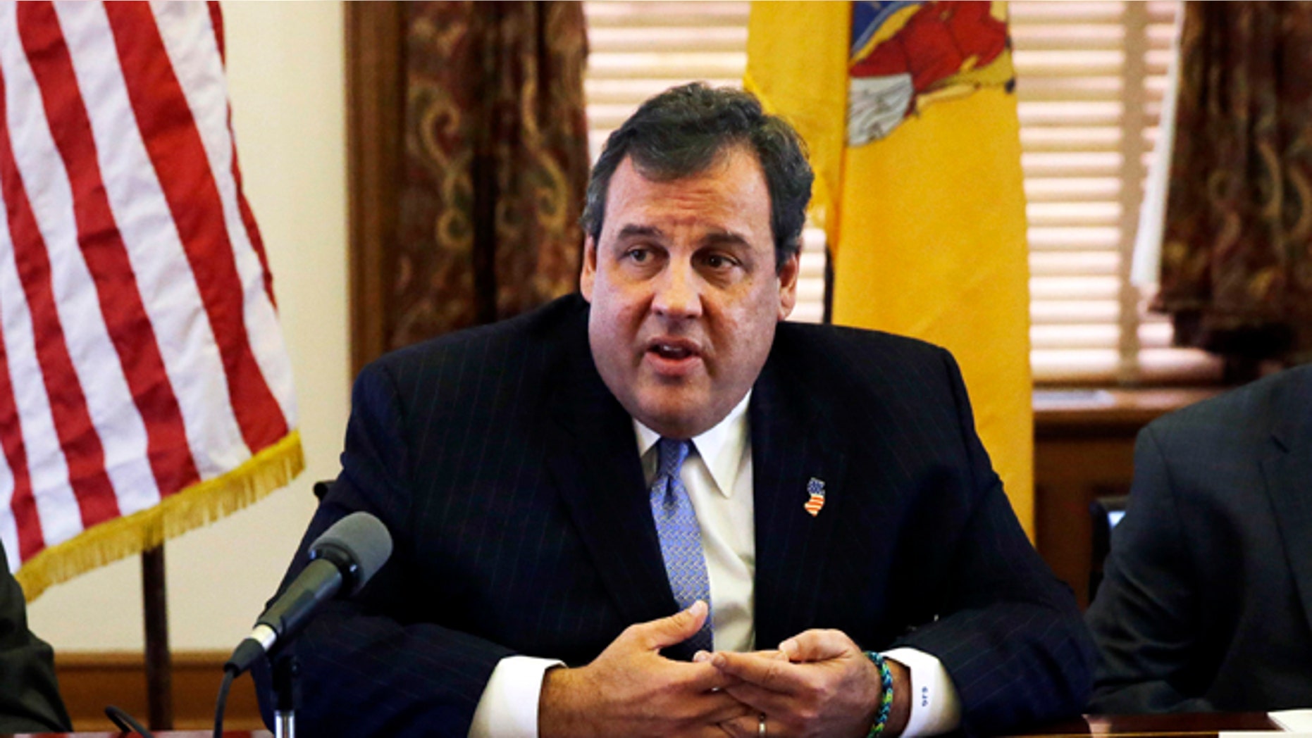 New Jersey Gov. Chris Christie, center, meets with members of his Cabinet at the Statehouse in Trenton, N.J., Tuesday, Nov. 12, 2013. (AP Photo/Mel Evans)