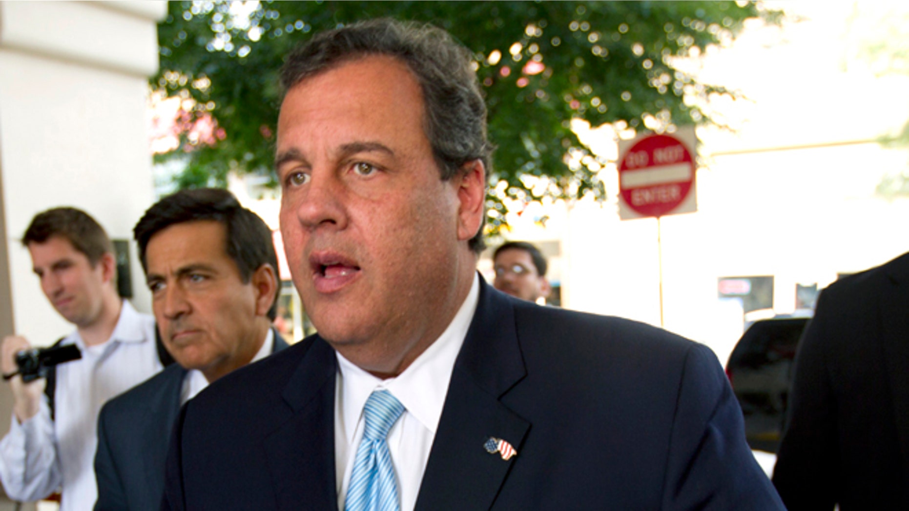 In this Wednesday, Sept. 17, 2014 photo, New Jersey Gov. Chris Christie walks into a fundraiser for Maryland Republican gubernatorial candidate Larry Hogan at Bethesda, Md.