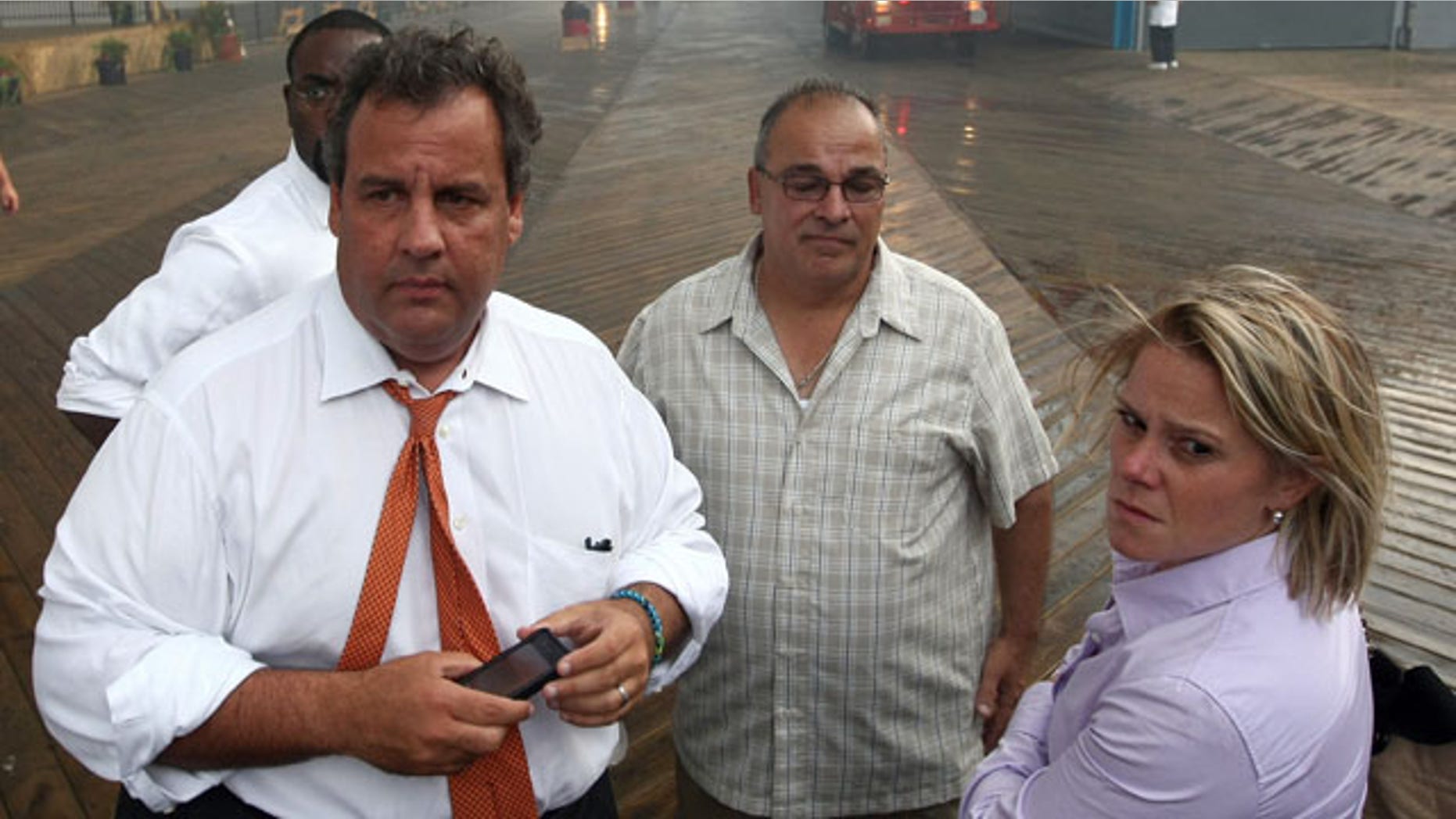 September 12, 2013: Deputy Chief of Staff Bridget Anne Kelly, right, stands with Gov. Chris Christie, left, during a tour of the Seaside Heights, N.J. boardwalk after it was hit by a massive fire. Christie fired Kelly Thursday, Jan. 9, 2014, and apologized over and over for his staff's "stupid" behavior, insisting during a nearly two-hour news conference that he had no idea anyone around him had engineered traffic jams as part of a political vendetta against a Democratic mayor. (AP Photo/Office of Gov. Chris Christie, Tim Larsen)