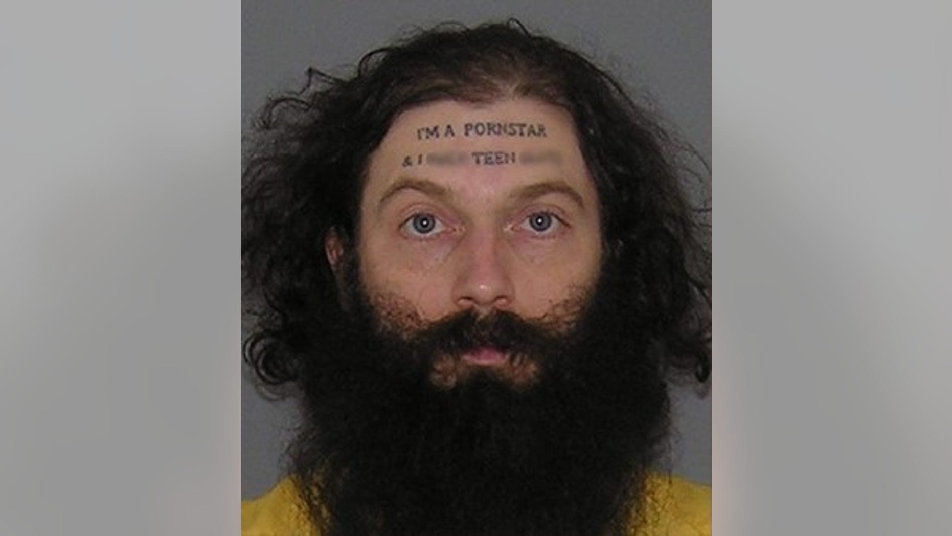 Christopher Wilson, 37, who has "I'm a pornstar" tattooed to his forehead, has been charged with sexual imposition and assault.